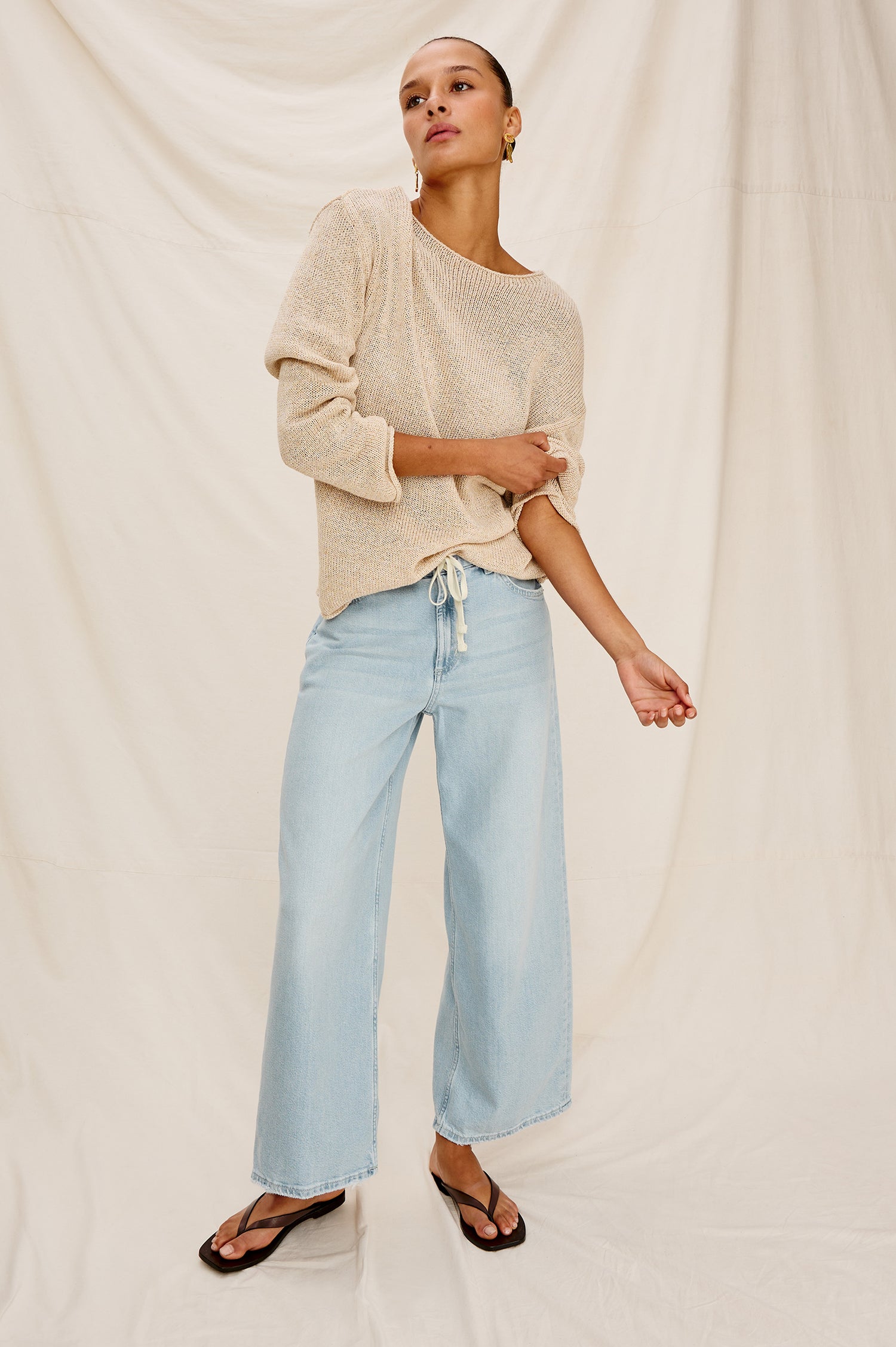 Angeleno Crop Denim Pant, Wide Leg, Five Pocket Zip Fly with a White Drawstring Tie at Waist in Light Wash Scuba Colorway. Front View Shown on Model.