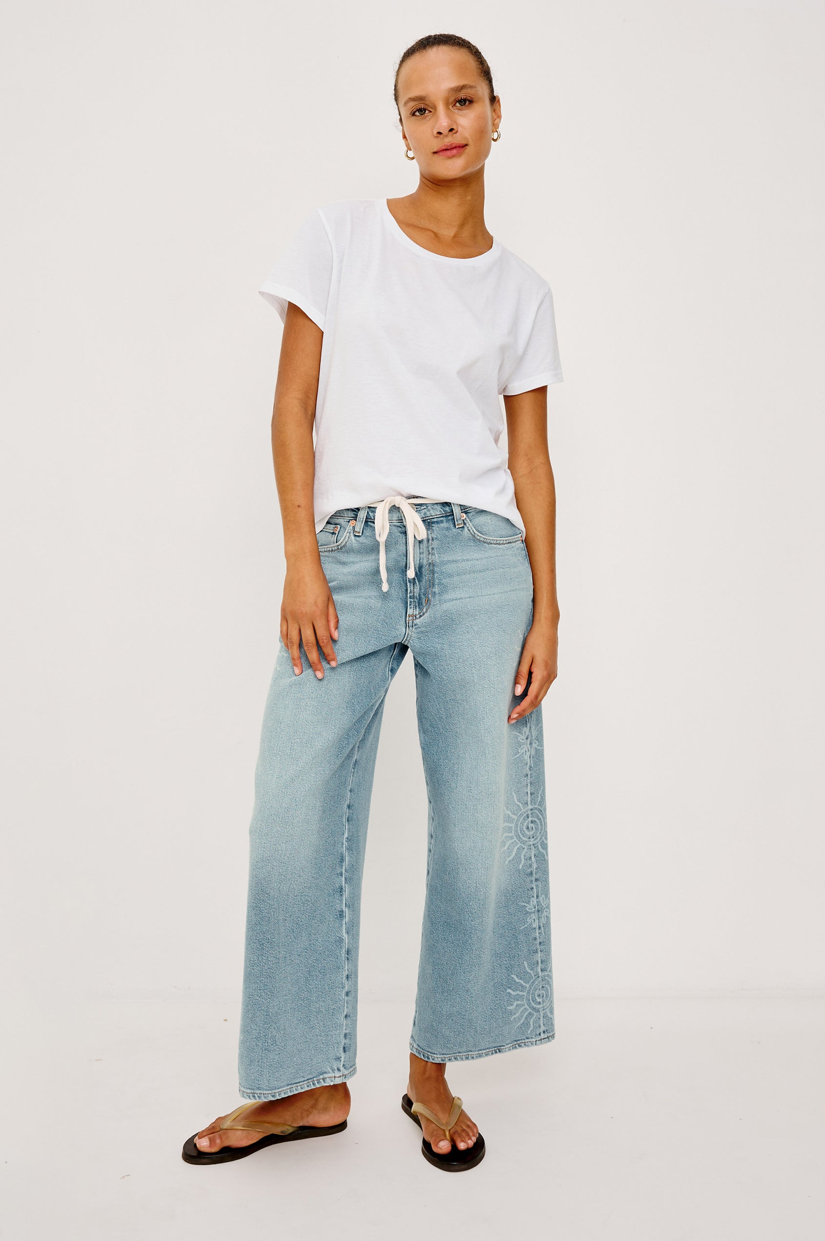 Angeleno Crop Wide Leg Jean in Rigid Denim With Slight Stretch, Mid-Rise, Front Zip Fly, and 5-Pockets in Soleil Laser Colorway - Full Body Front VIew Featured on Model