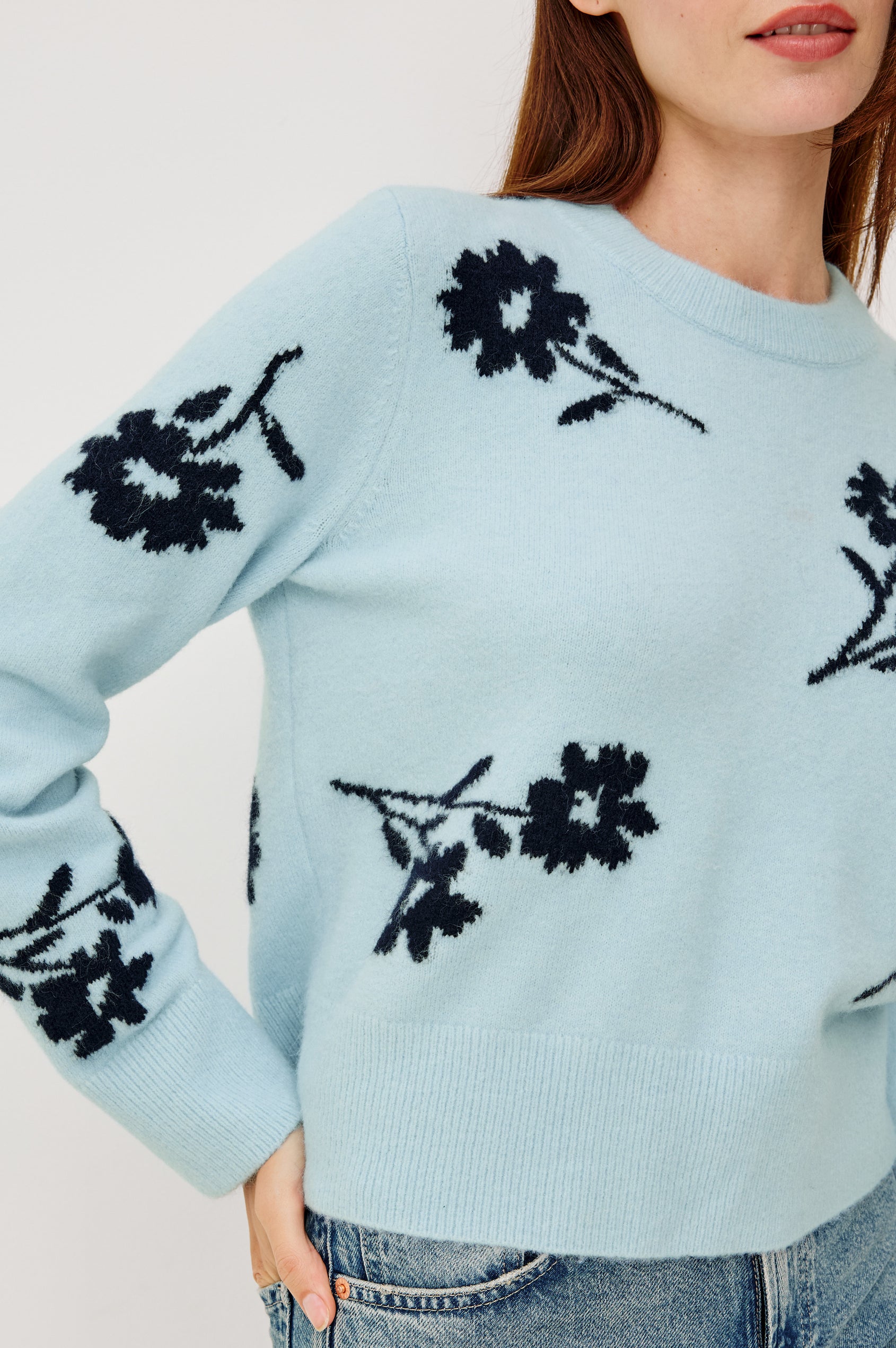 Anise Sweater in Wool Blend With Contrast Floral Motifs, Crew Neckline, Long Sleeves, and Relaxed Boxy Fit in Winter Blue Floral Colorway - Upper Body Front Close Up View Featured on Model