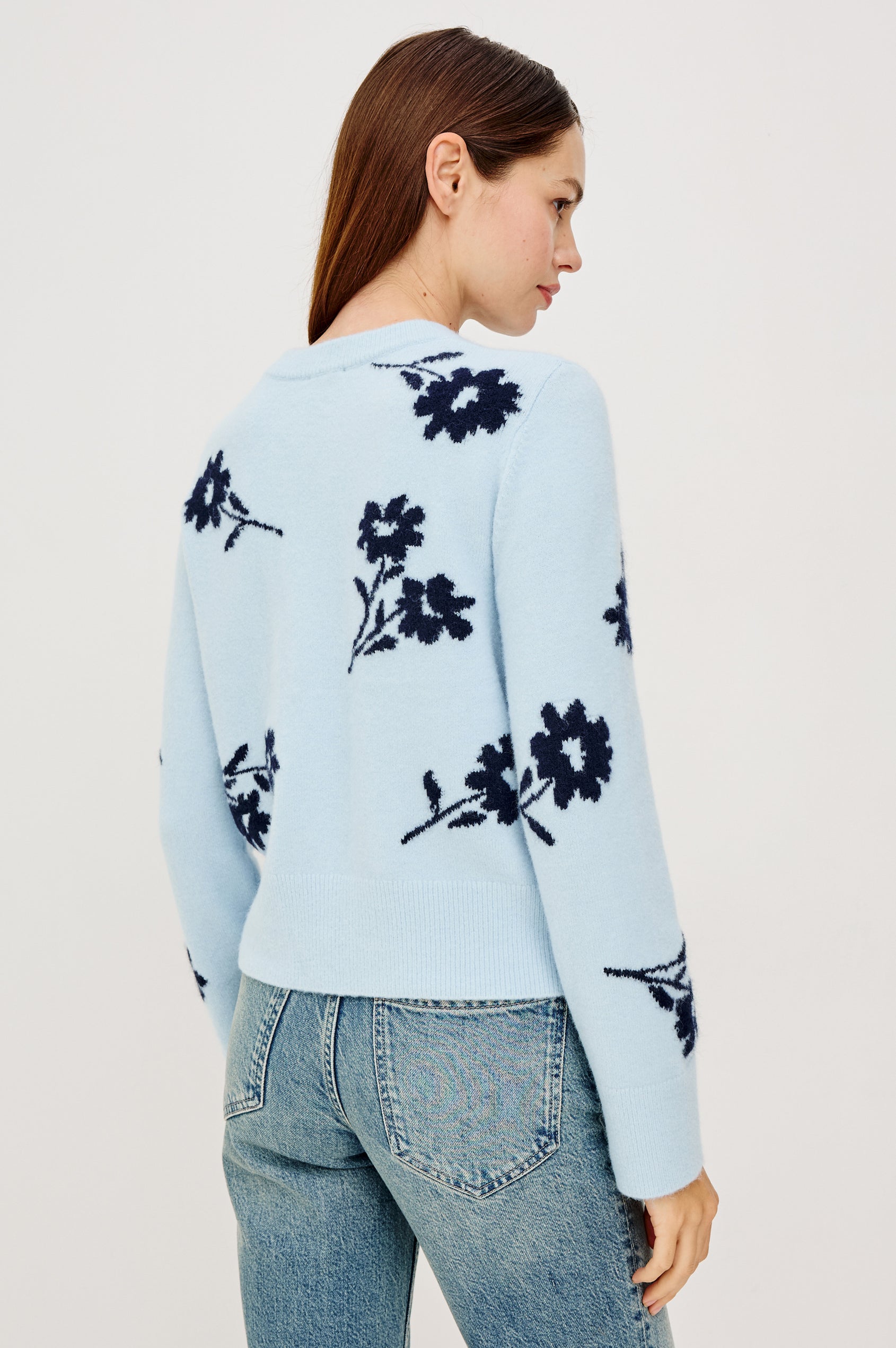 Anise Sweater in Wool Blend With Contrast Floral Motifs, Crew Neckline, Long Sleeves, and Relaxed Boxy Fit in Winter Blue Floral Colorway - Upper Body Back Close Up View Featured on Model