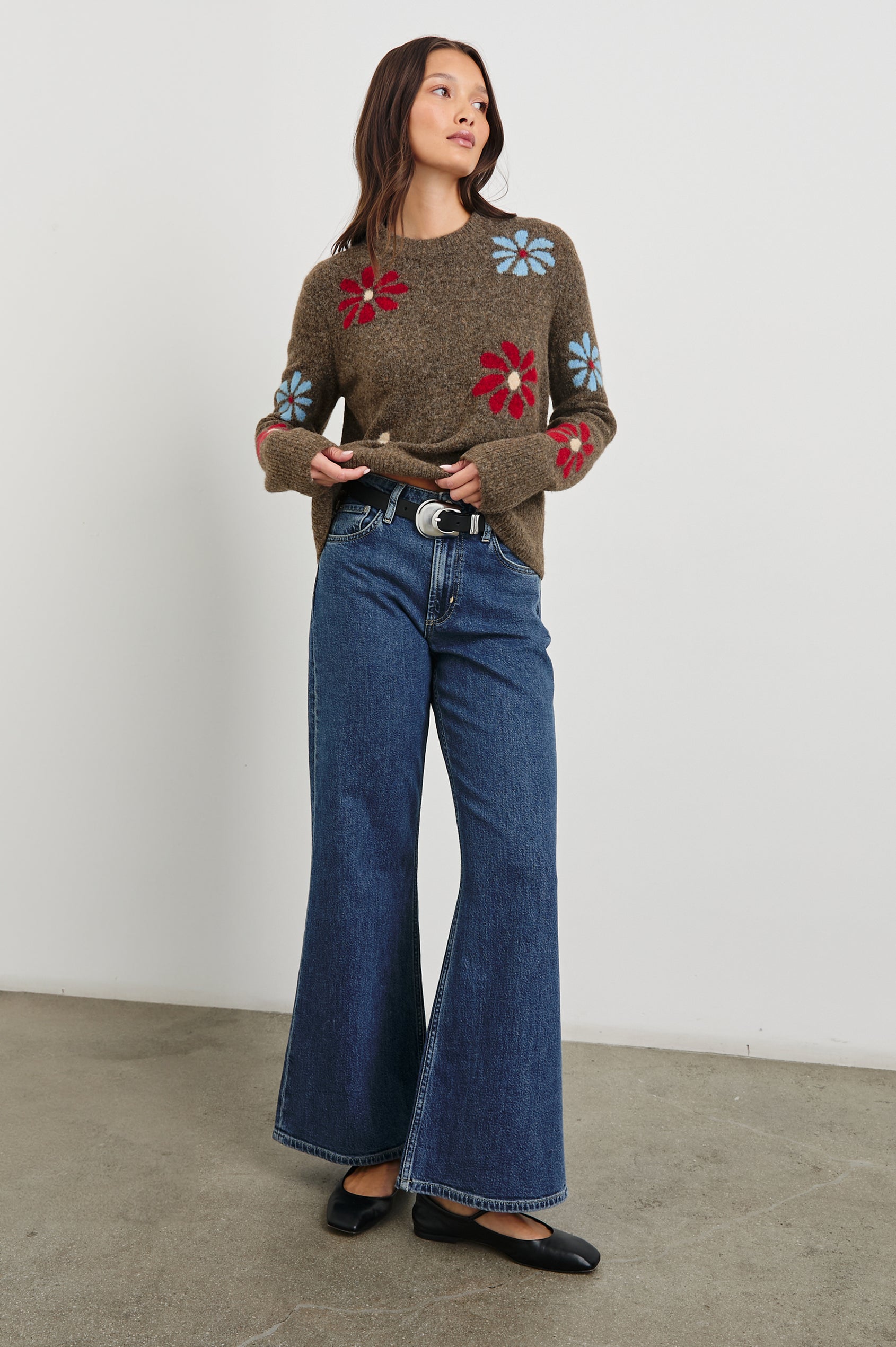 Anise Long-Sleeve Sweater with a Crew Neck and Ribbed Trim in Winter Floral Colorway, with Blue, Cream and Red Flowers on Brown - Front Full Body View Featured on Model