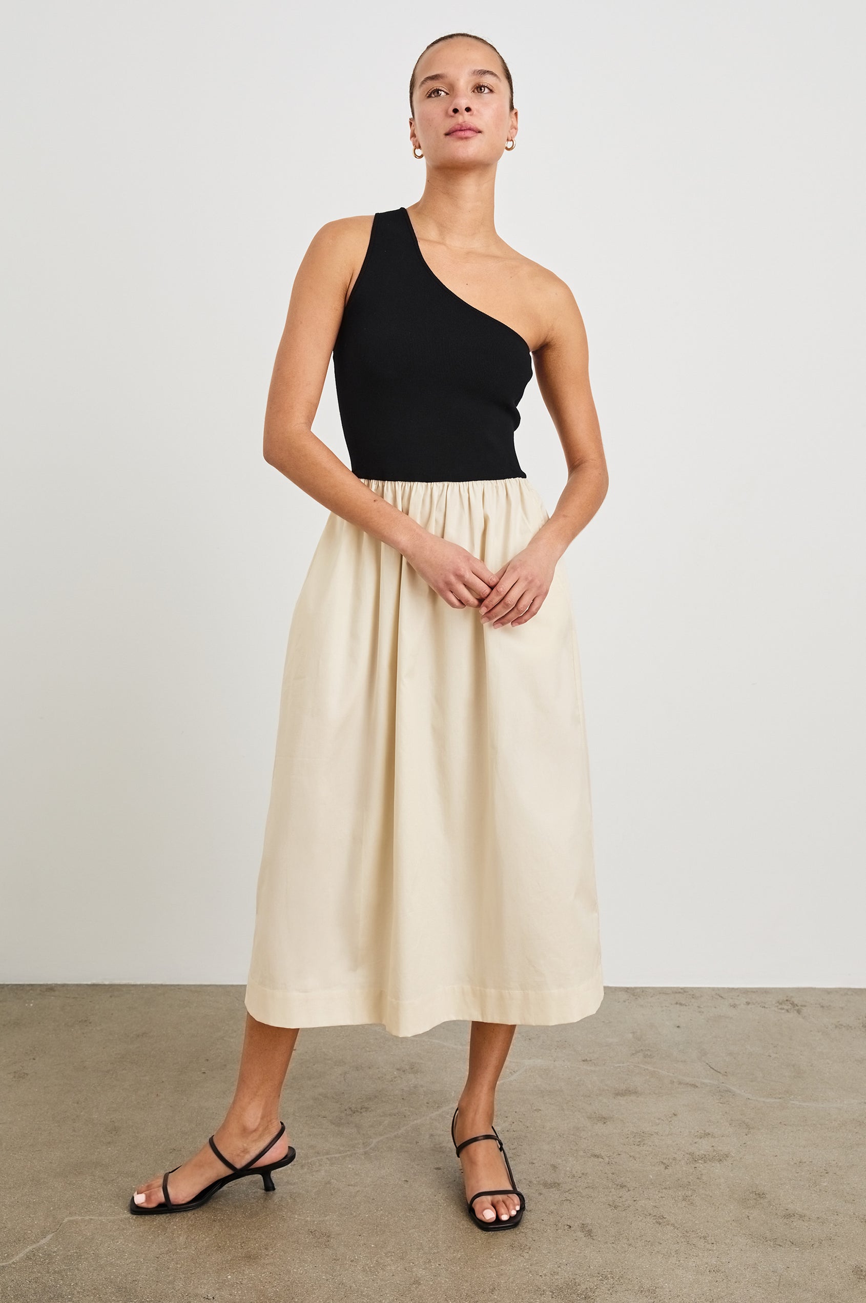 Anita Dress with Black asymmetrical bodice and ivory poplin midi skirt - front view on model.