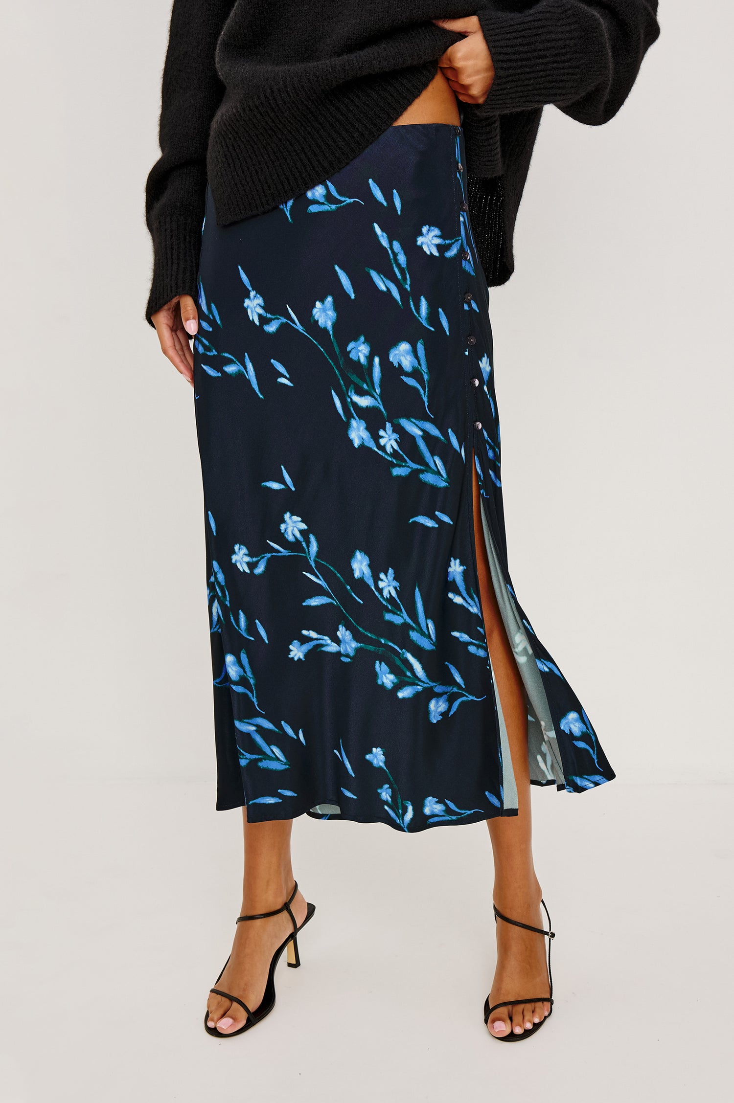 Anya High-Waisted Midi Skirt in Satin Crepe With Side Slit in Blue Carnation Floral Print - Close Up Mid Body View Featured on Model