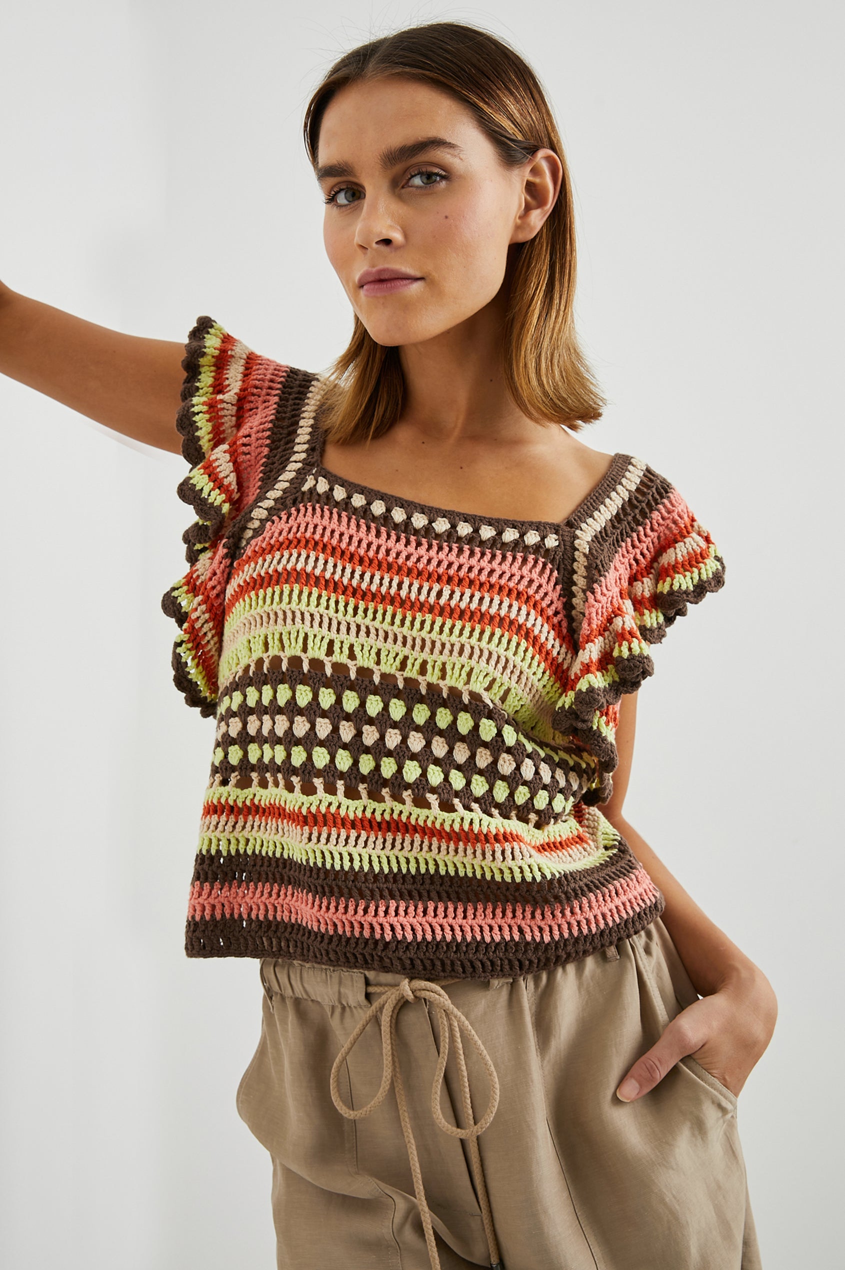 Anna Short Sleeve Crochet Top with Flared Sleeves and a Square Neck in Tropical Crochet Colorway, in Orange, Pink, Green, Brown, and White - Front View Featured on Model  