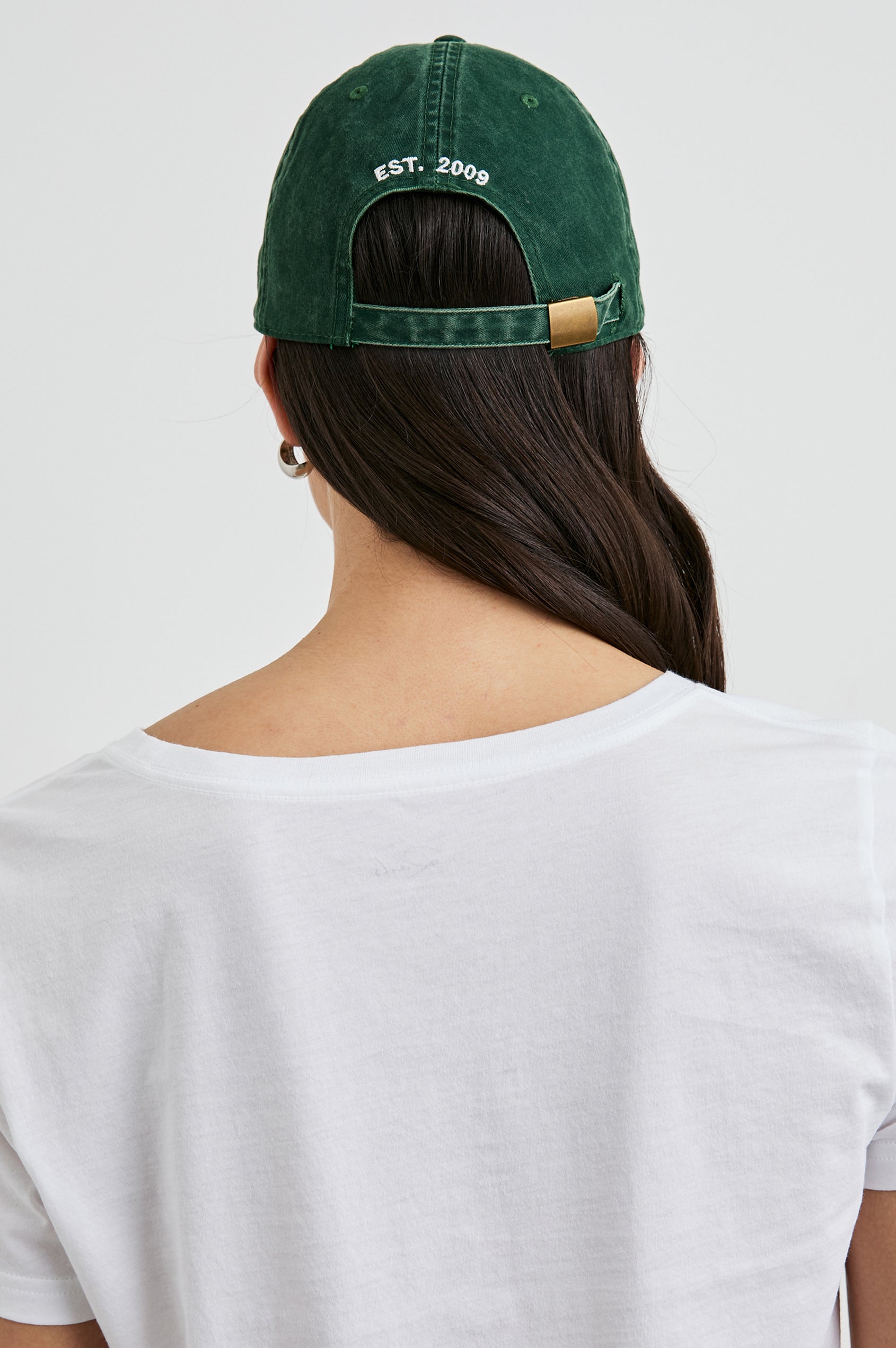 Anniversary Baseball Cap with an Adjustable Back Strap, Front Text, Rails, and Back Text, Est 2009, in Forest Colorway, with White Text - Back View Featured on Model