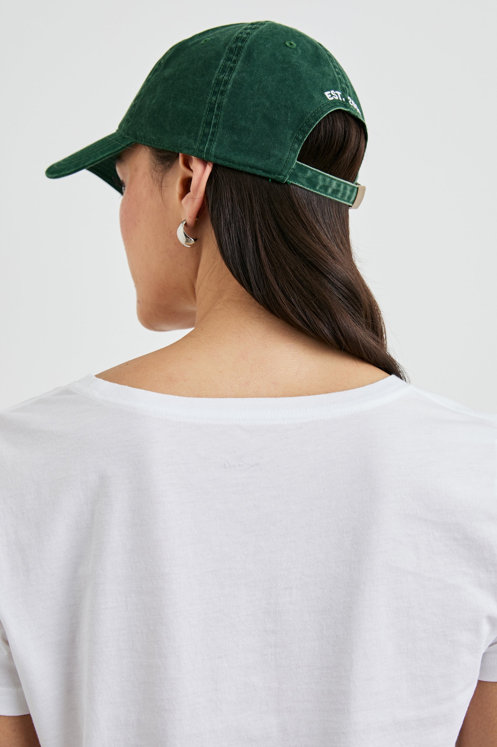 Anniversary Baseball Cap with an Adjustable Back Strap, Front Text, Rails, and Back Text, Est 2009, in Forest Colorway, with White Text - Back View Featured on Model