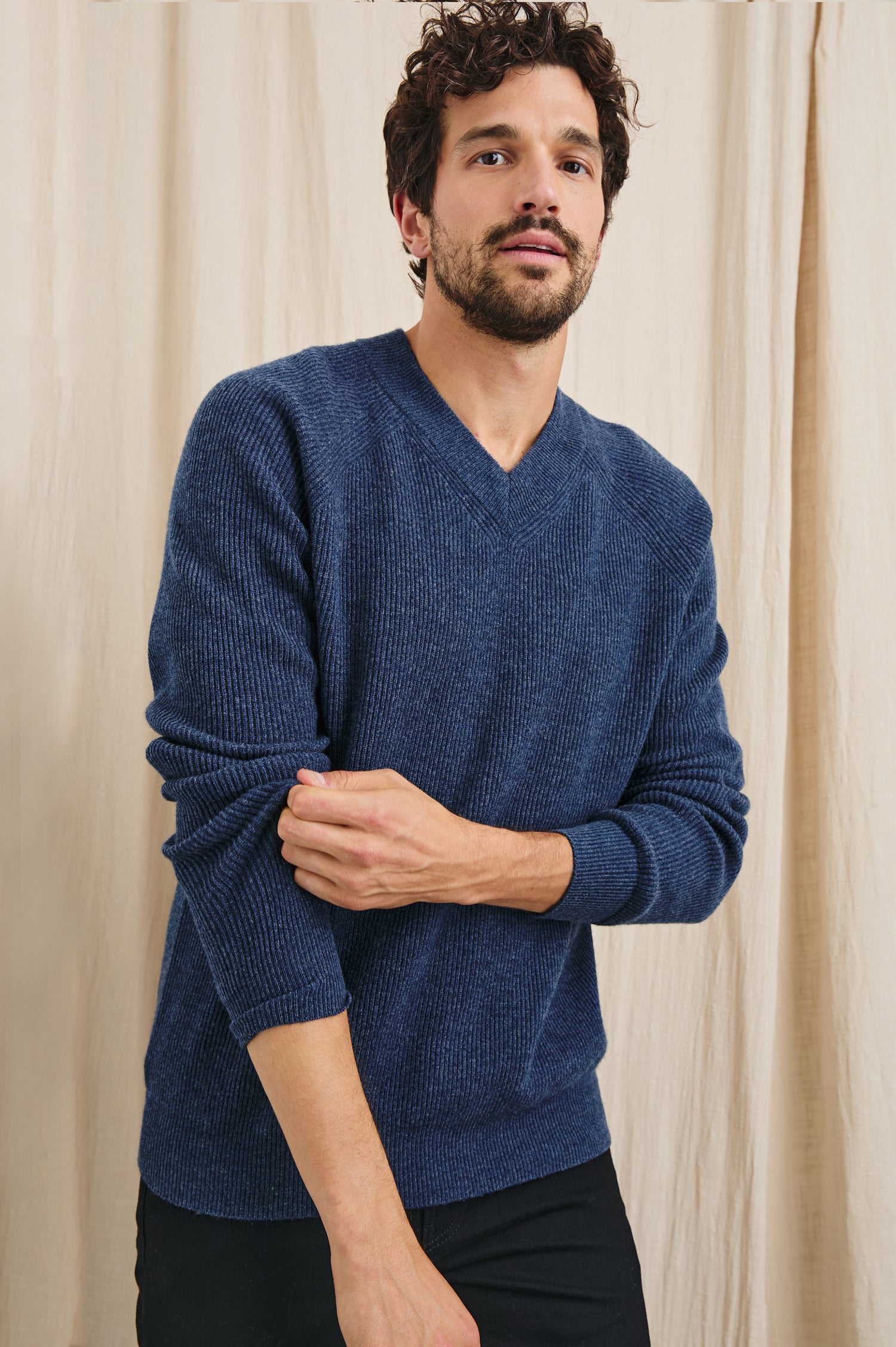 Ansel Long-Sleeve Ribbed Sweater with a V-neck in Blue Melange Colorway - Front View Featured on Model