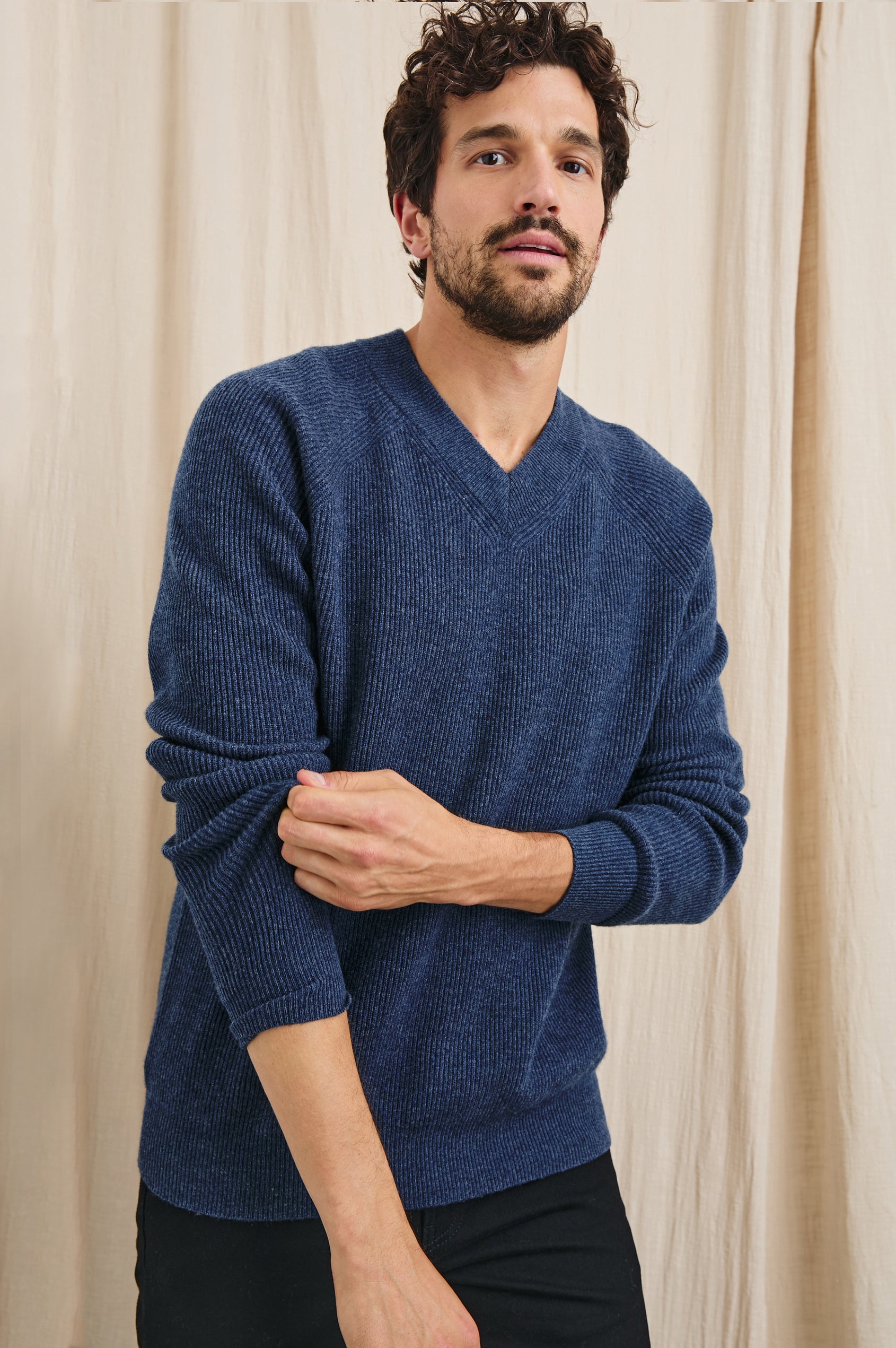 Ansel Long-Sleeve Ribbed Sweater with a V-neck in Blue Melange Colorway - Front View Featured on Model