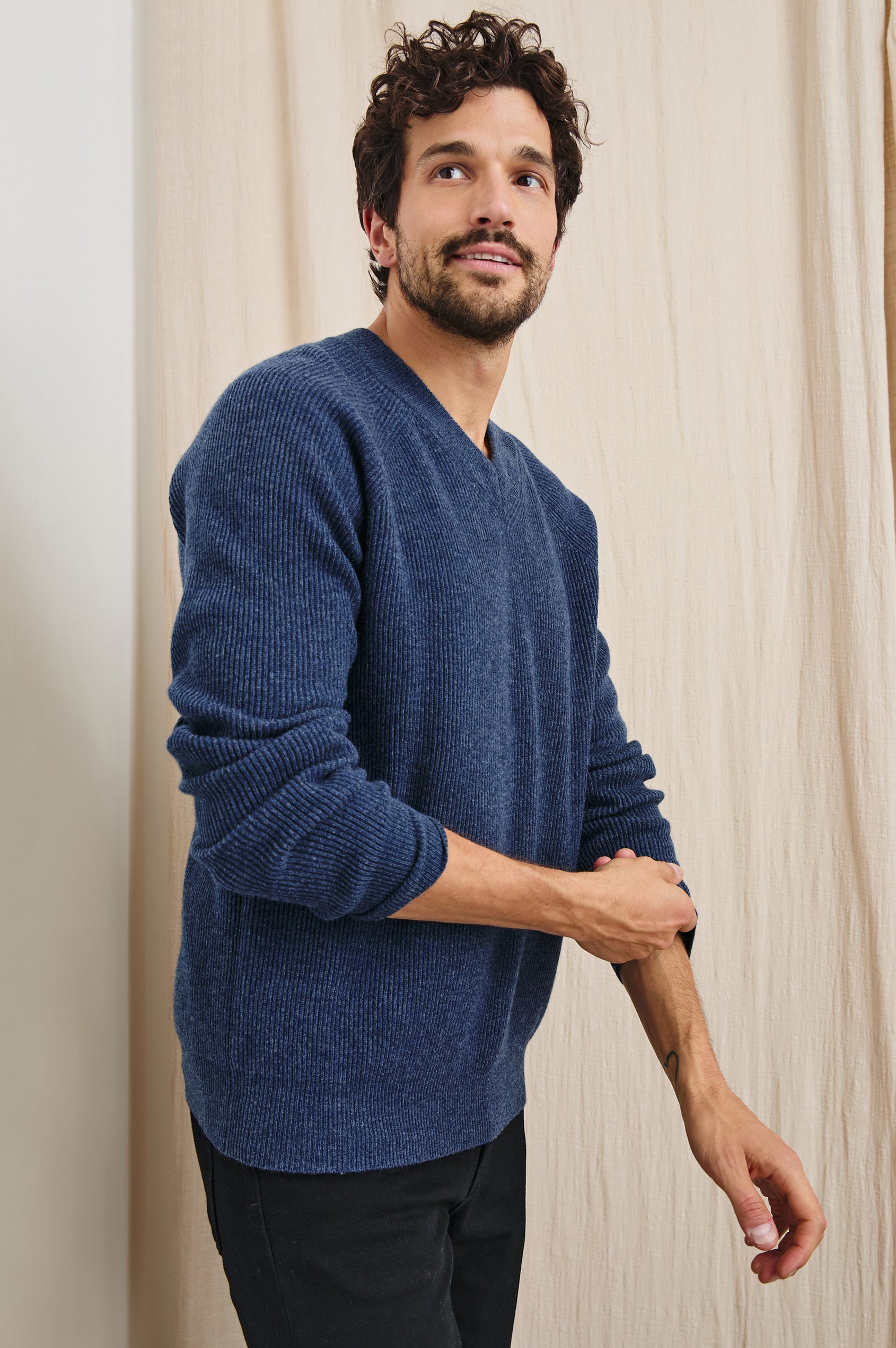 Ansel Long-Sleeve Ribbed Sweater with a V-neck in Blue Melange Colorway - Front View Featured on Model