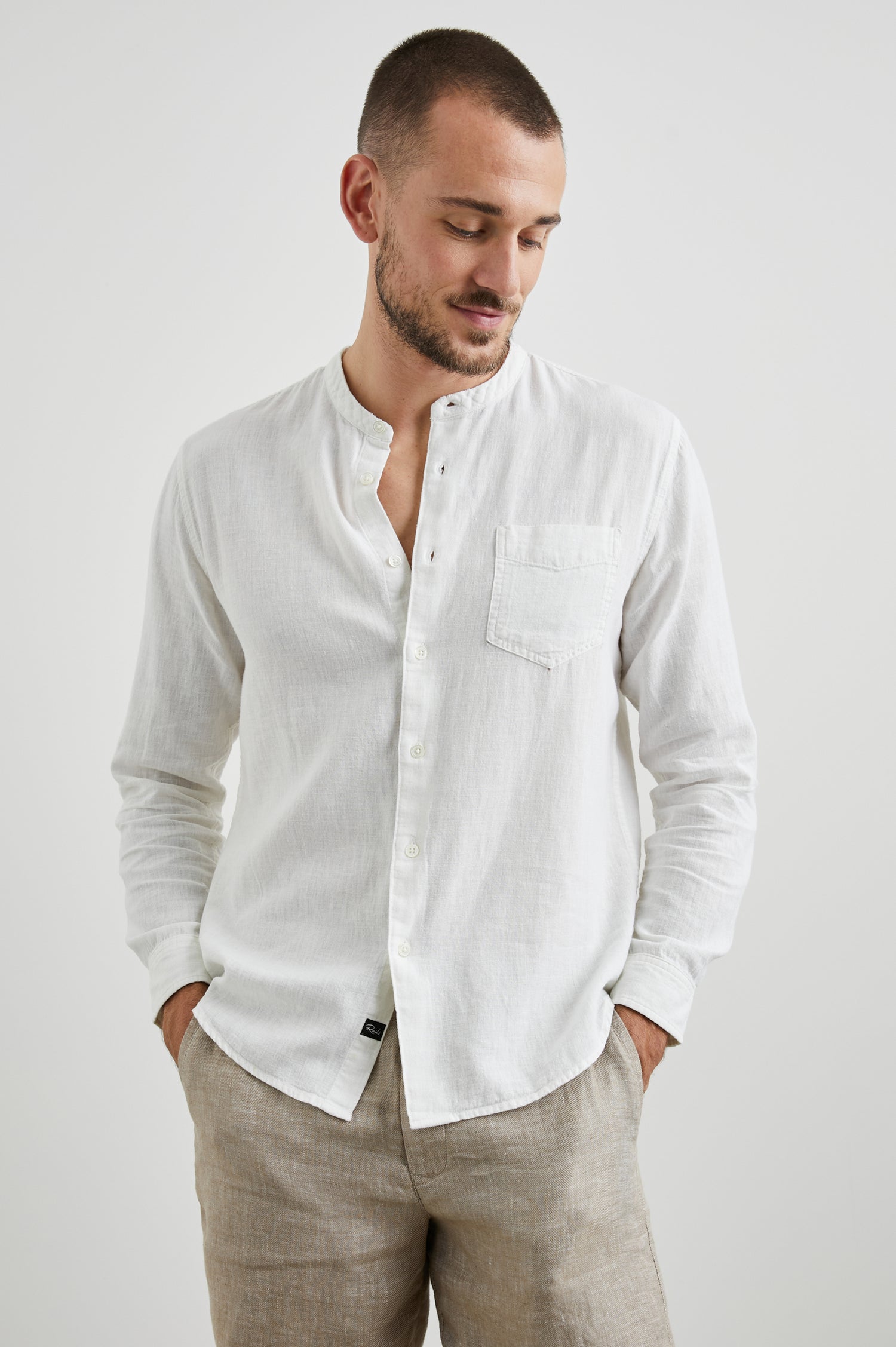 Antoine Long-Sleeve Button Up Without a Collar and with a Chest Patch Pocket in Antique White Colorway - Front View Featured on Model 