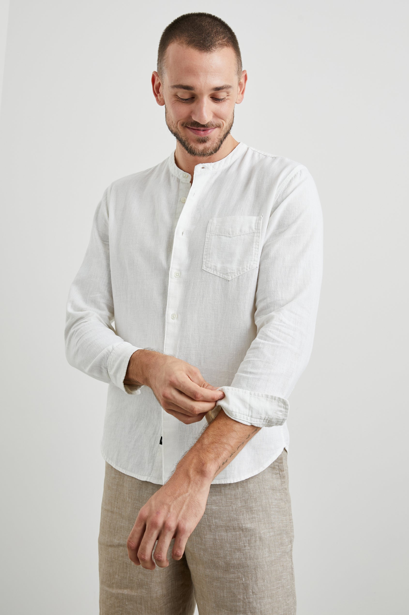 Antoine Long-Sleeve Button Up Without a Collar and with a Chest Patch Pocket in Antique White Colorway - Front View Featured on Model 