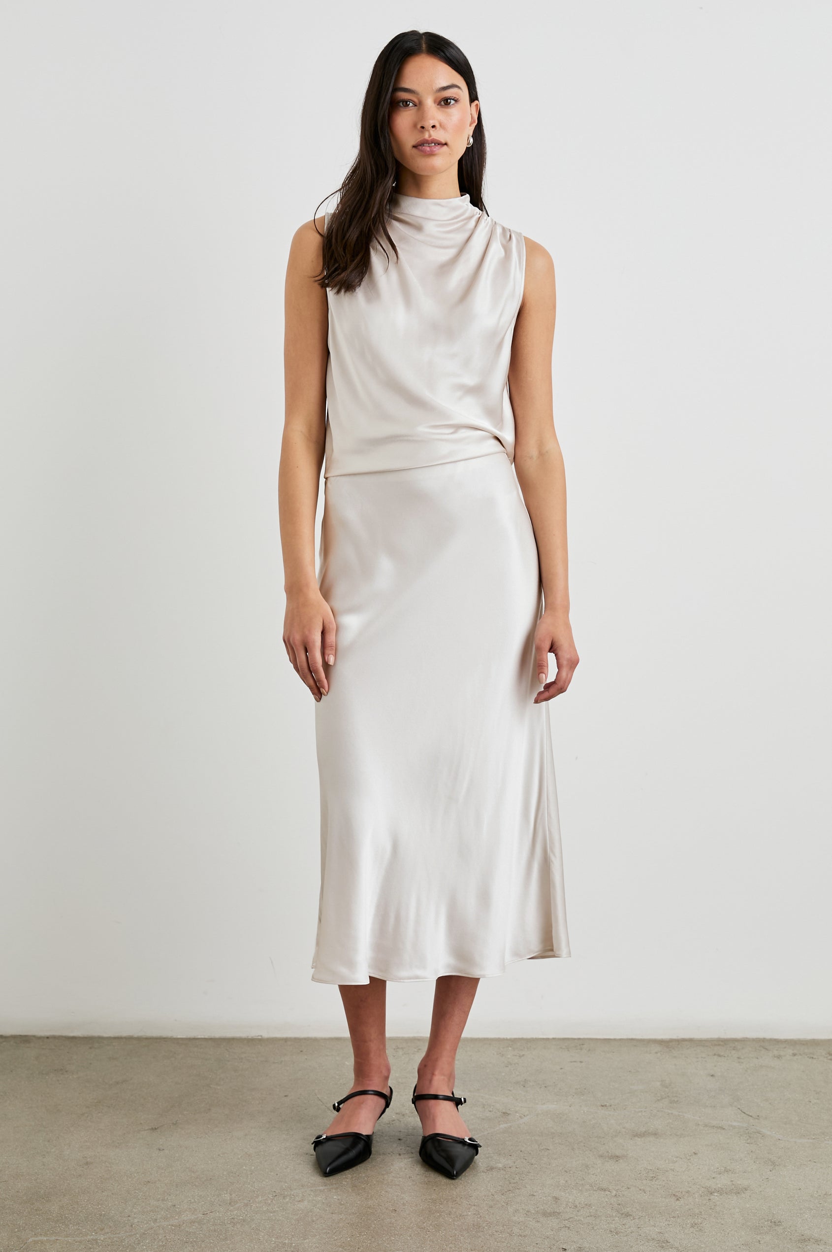 Anya High-waisted Midi Skirt in Ivory Colorway - Front Full Body View Featured on Model