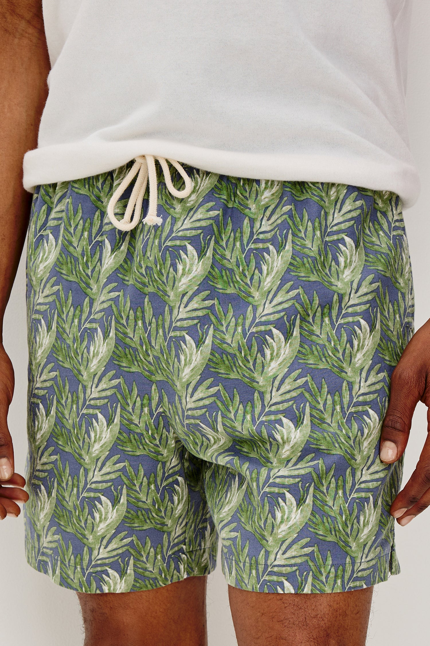 Aries mid length linen short with Side Pockets and a drawstring at waistband in Slate Seaweed Print Patter - front detail view on model.