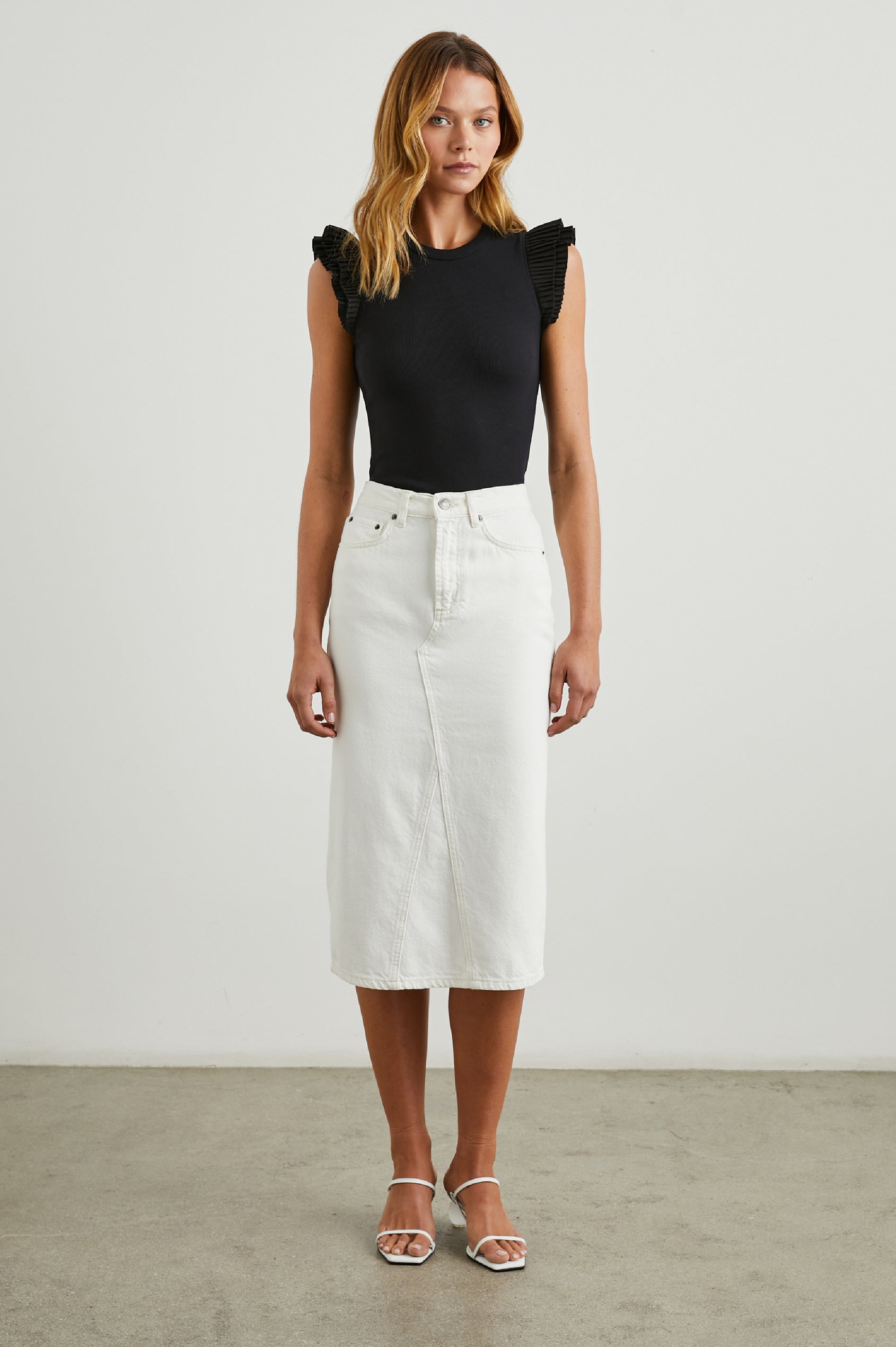 Asha Short-Sleeve Ribbed Top with a Crew Neck and Pleated Flutter Sleeves in Black Colorway - Front Full Body View Featured on Model