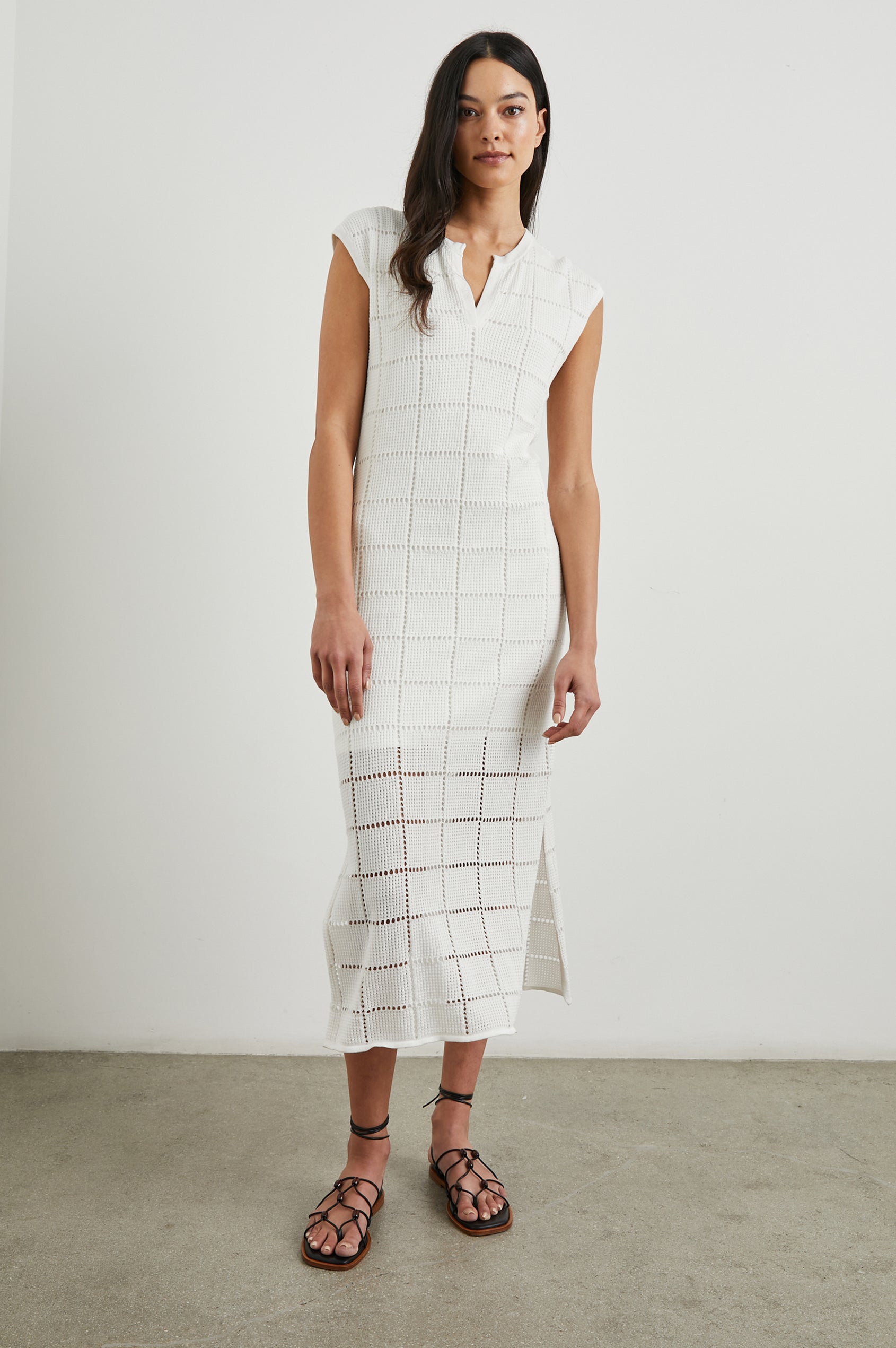 Ashley Short-Sleeve, Open Knit Midi Dress with Cap Sleeves, a V Neck Placket and a Side Slit in White Colorway - Front Full Body View Featured on Model 