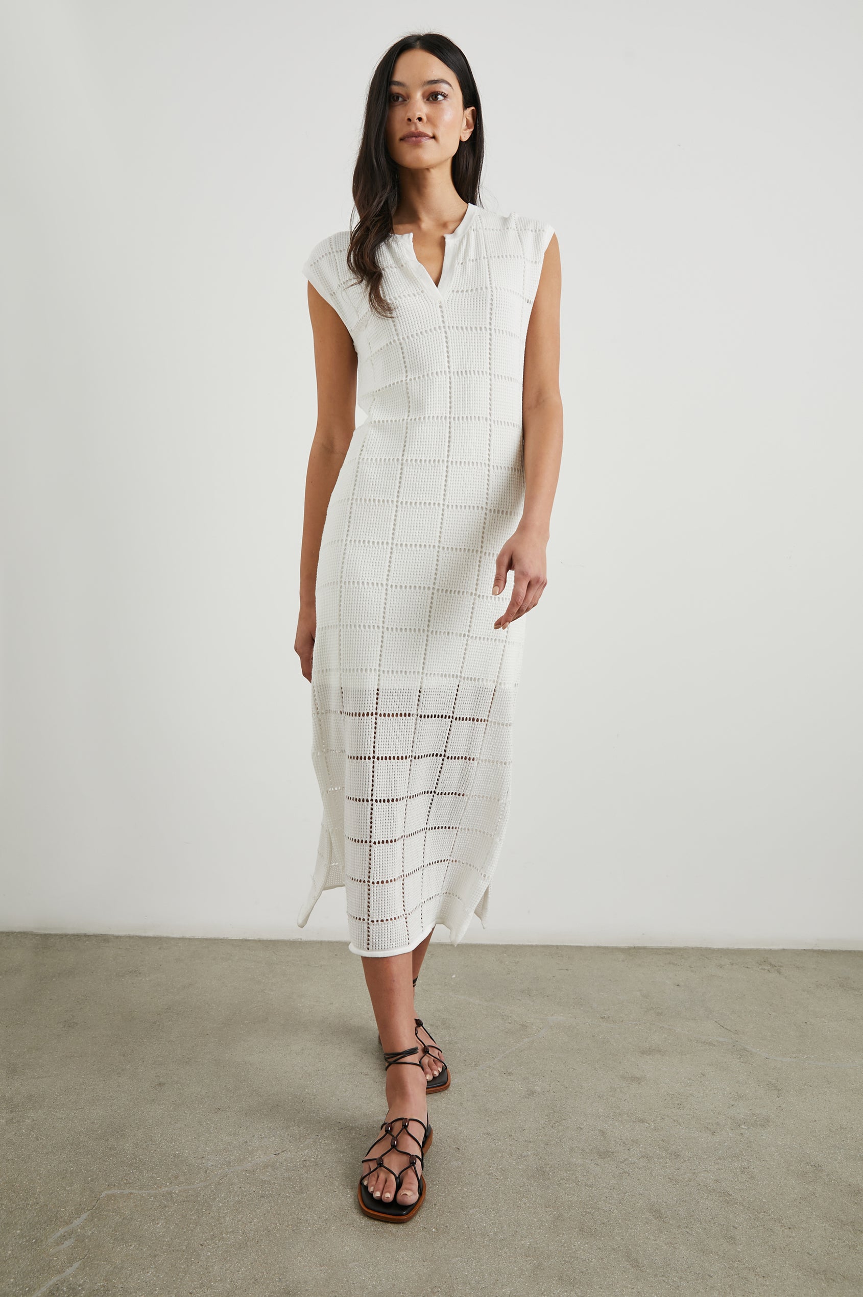 Ashley Short-Sleeve, Open Knit Midi Dress with Cap Sleeves, a V Neck Placket and a Side Slit in White Colorway - Front Full Body View Featured on Model 