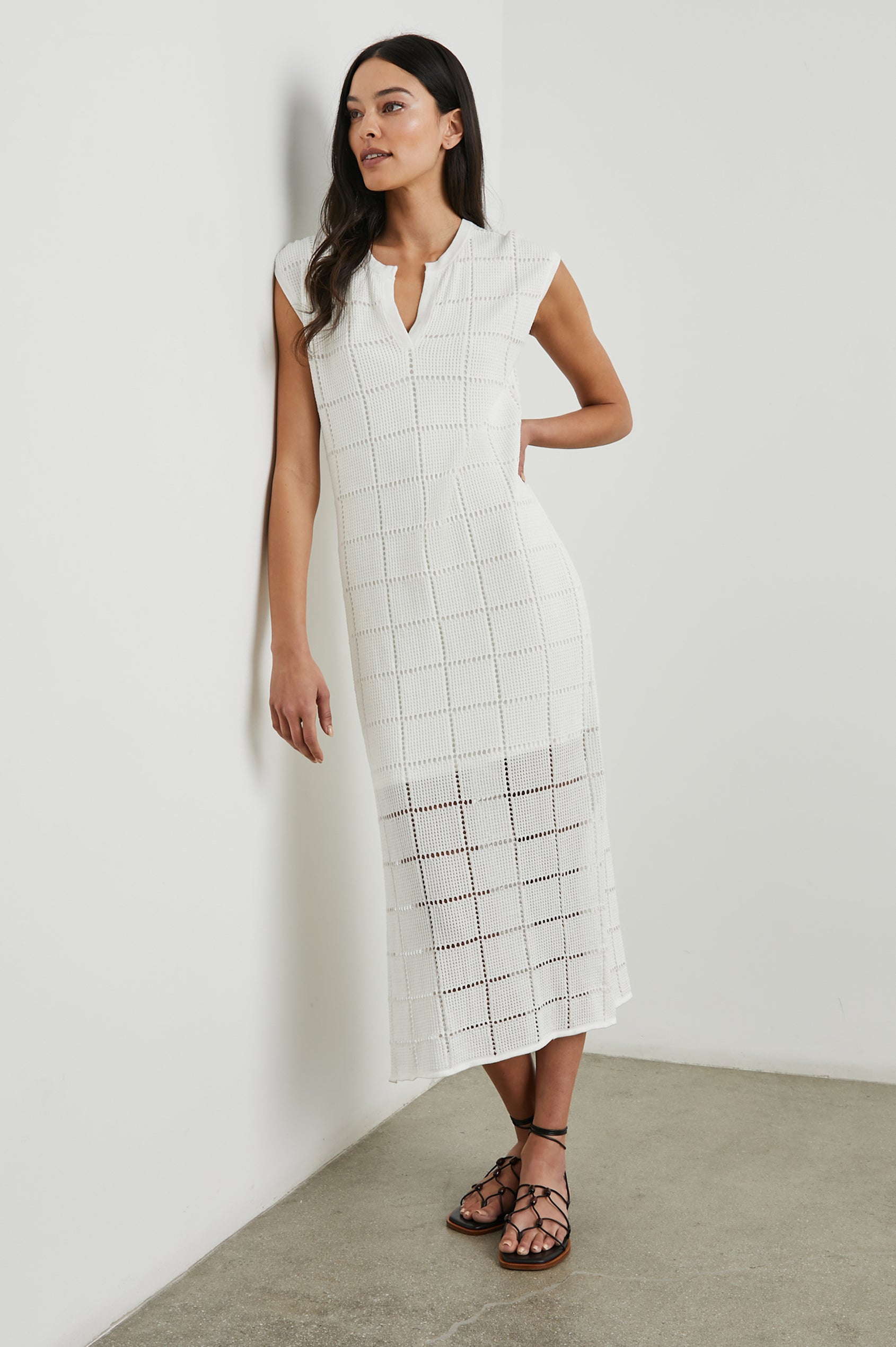 Ashley Short-Sleeve, Open Knit Midi Dress with Cap Sleeves, a V Neck Placket and a Side Slit in White Colorway - Front Full Body View Featured on Model 