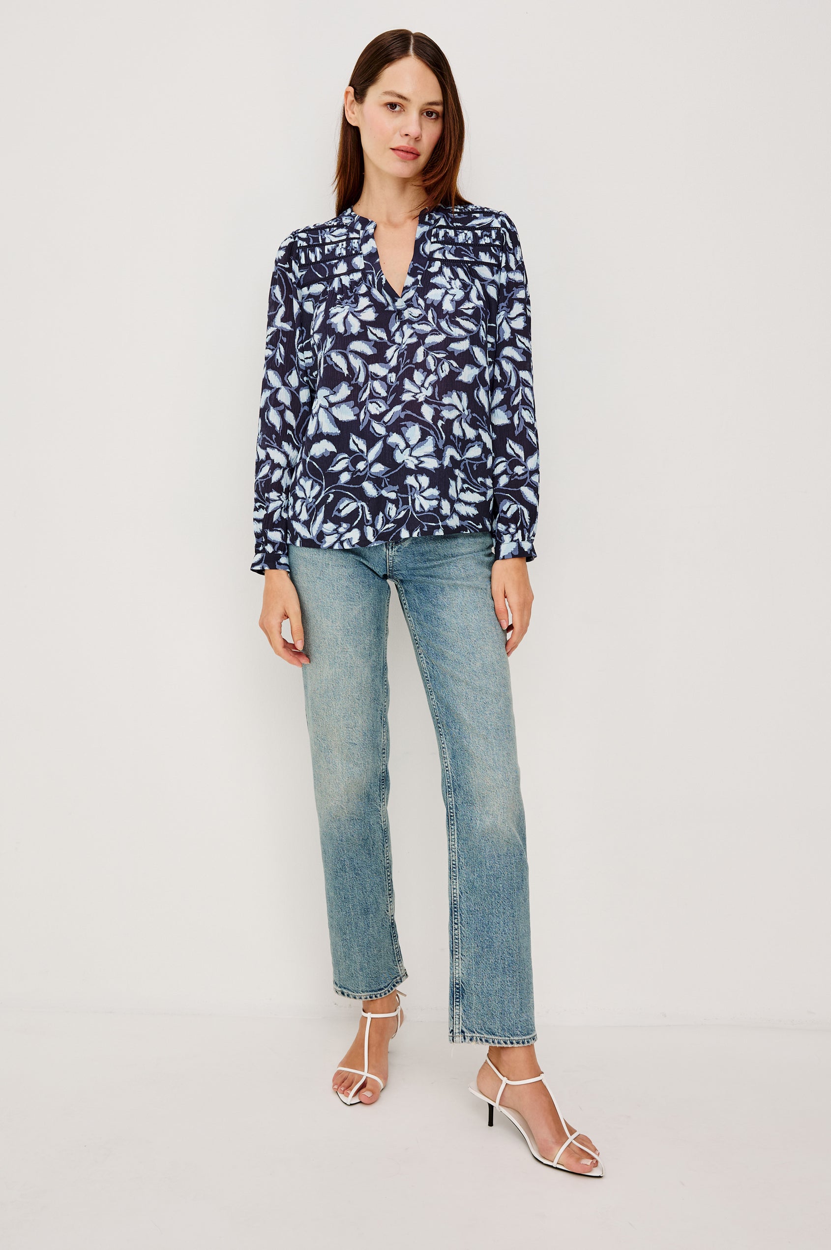 Asta Top in Floral Print Pleated Chiffon With V-Neckline, Inset Ladder Trim at Yoke, and Long Billowing Sleeves With Fitted Cuffs in Navy Jasmine Colorway - Full Body Front View Featured on Model