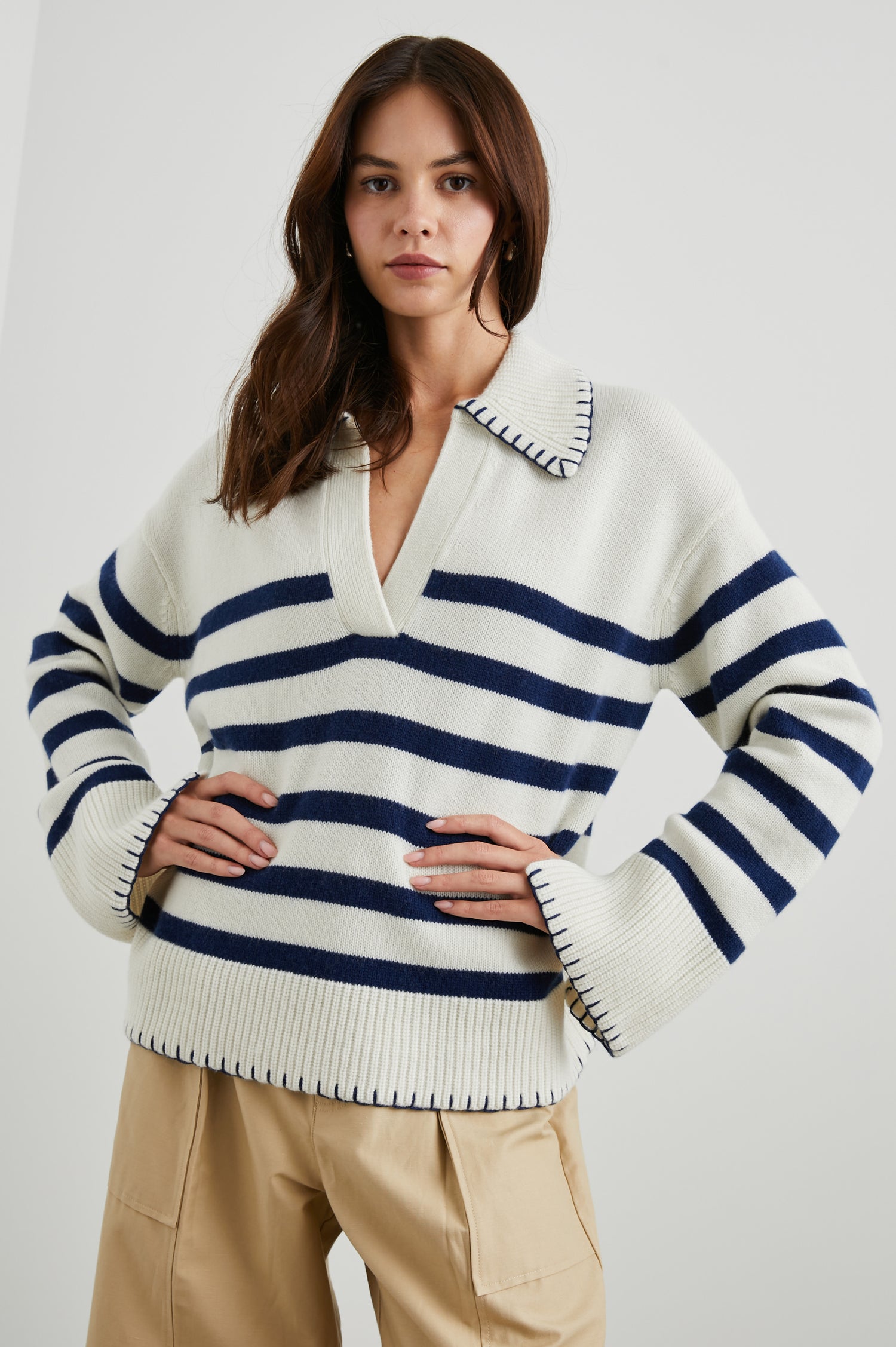 Athena Long-Sleeve Sweater with a Flat Collar V Neckline, Ribbed Cuffs and Hem and Contrast Stitching at the Cuffs and Hem in Ivory Navy Stripe Colorway, Horizontal Stripes - Front View Featured on Model 