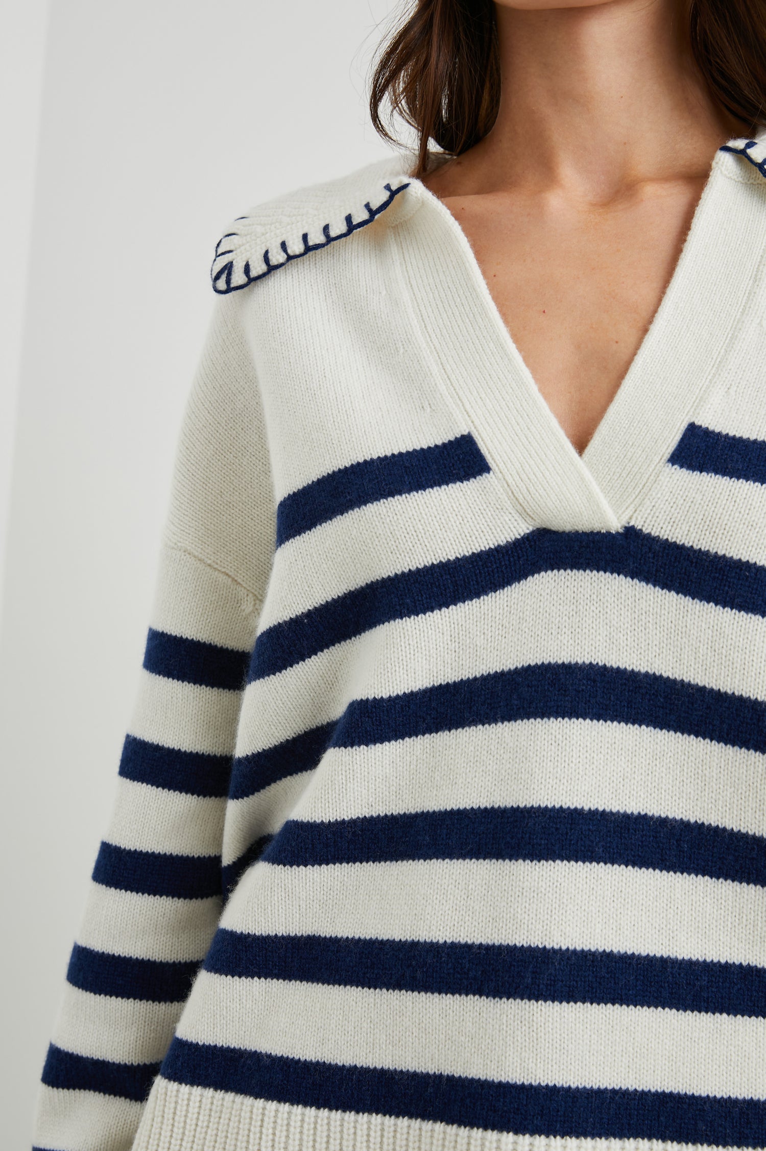 Athena Long-Sleeve Sweater with a Flat Collar V Neckline, Ribbed Cuffs and Hem and Contrast Stitching at the Cuffs and Hem in Ivory Navy Stripe Colorway, Horizontal Stripes - Front View Featured on Model 