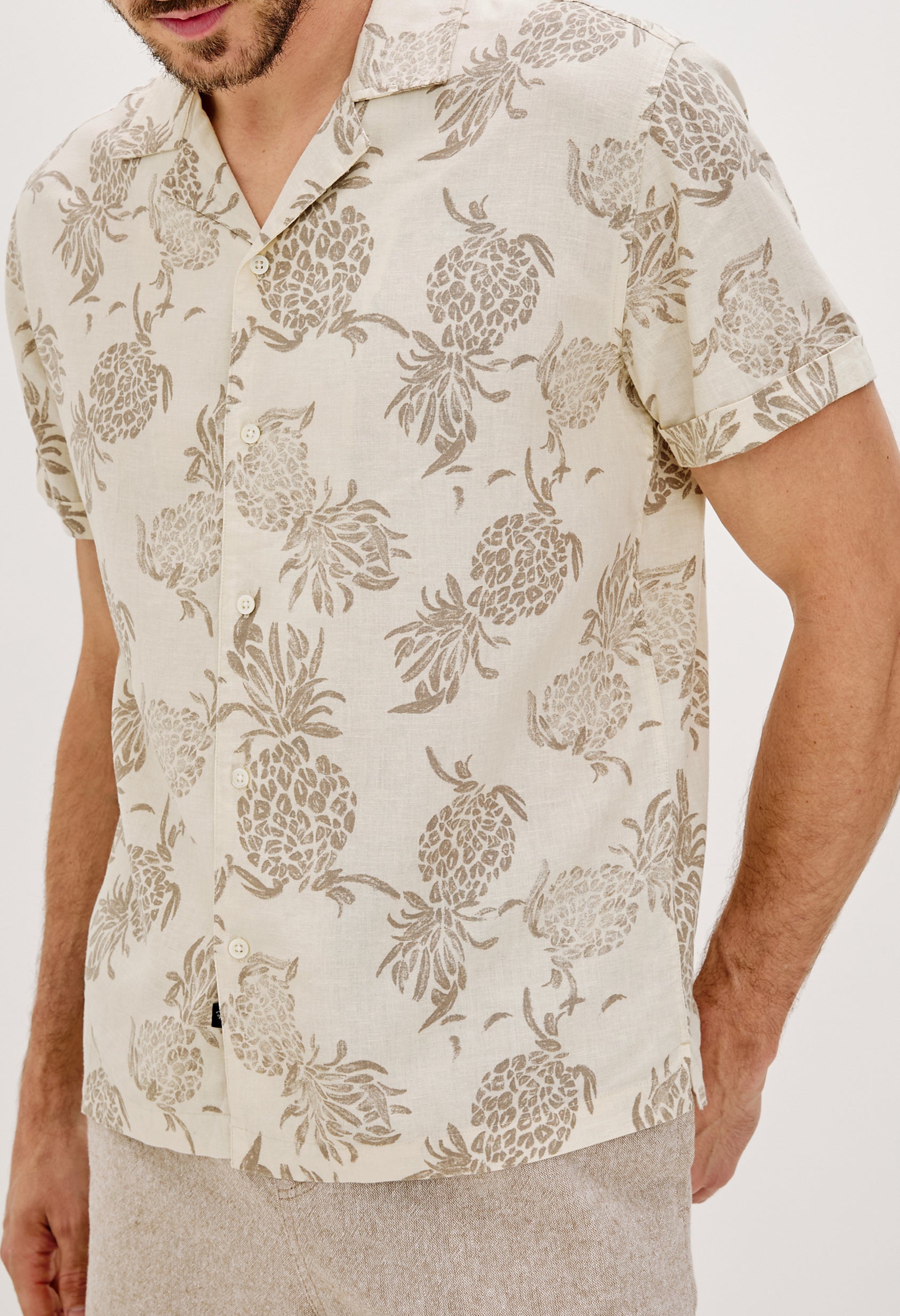 Atlas Printed Button Front Shirt with Short Sleeves, Flat Collar and Lapel in Pineapple Block Ecru Colorway. Front Detail View Shown on Model.