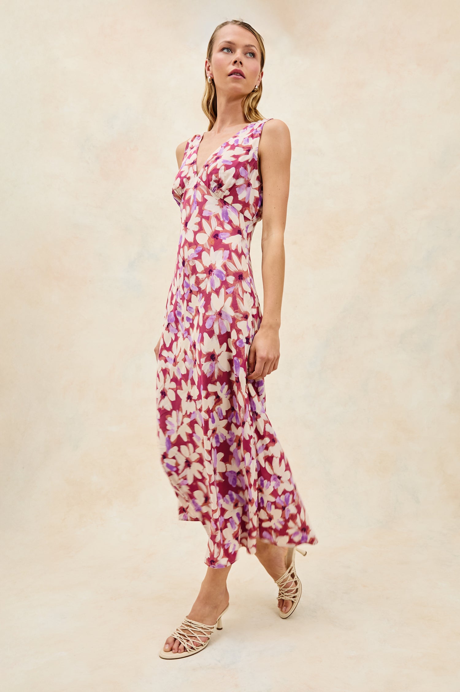 Audrina Sleeveless Midi Dress with Wide Shoulder Straps, a Deep V Neck and V-Back, and an Empire Waist in Amaranth Colorway - stylized full body front view on model