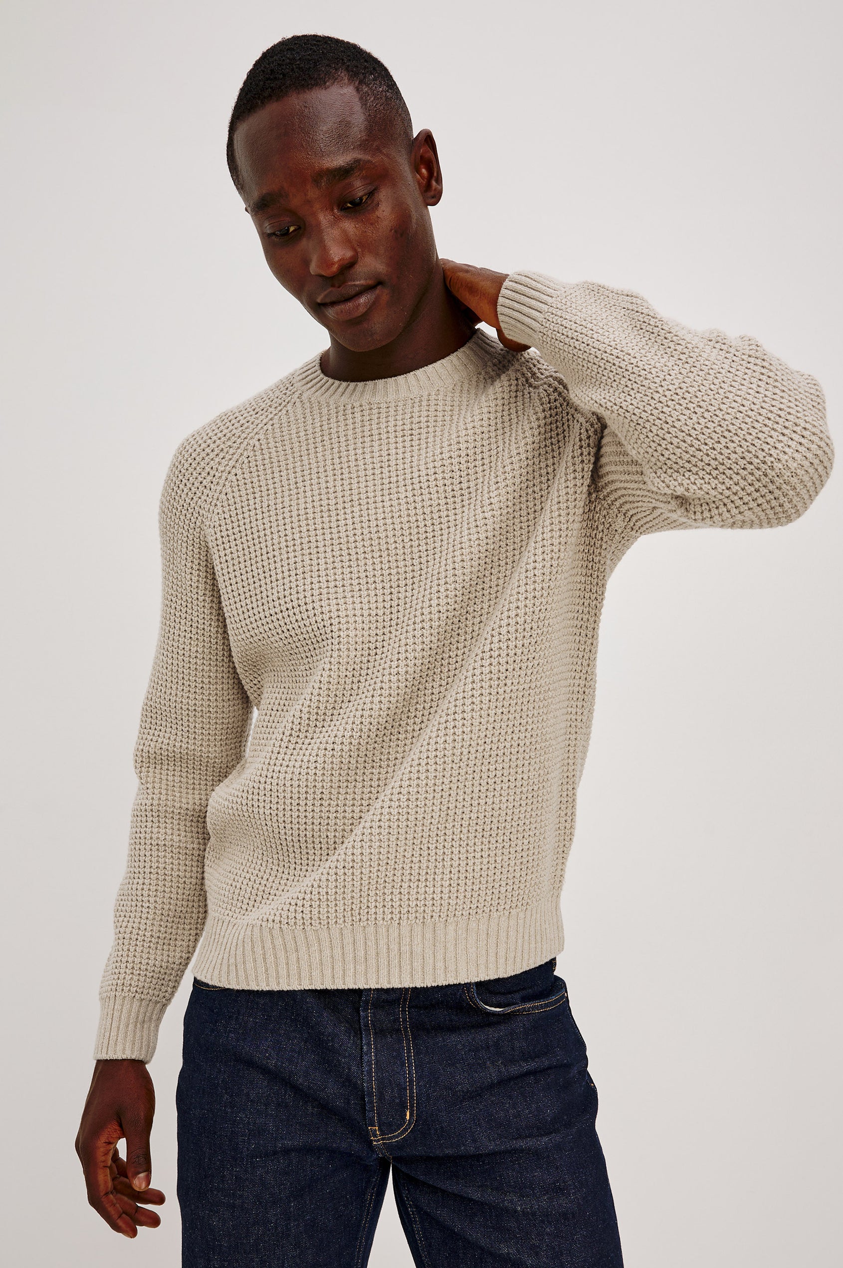 Augustus Sweater in Midweight Cotton-Linen Knit With Thermal Stitch, Textured Bouclé Finish, Raglan Long Sleeves, and Ribbed Trim in Vellum Colorway - Upper Body Front View Featured on Model