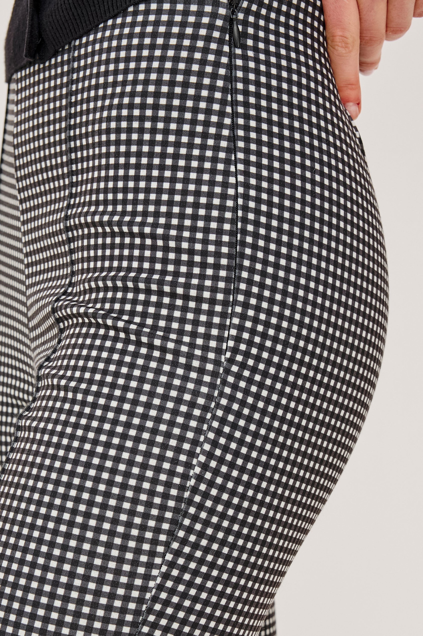 Auray Pant in Ponte With High-Waisted Fit Front Pintuck Detailing Cropped Length Elastic Waistband and Kick Flare at Hem in Black Gingham Colorway - Lower Body Close Up View Featured on Model