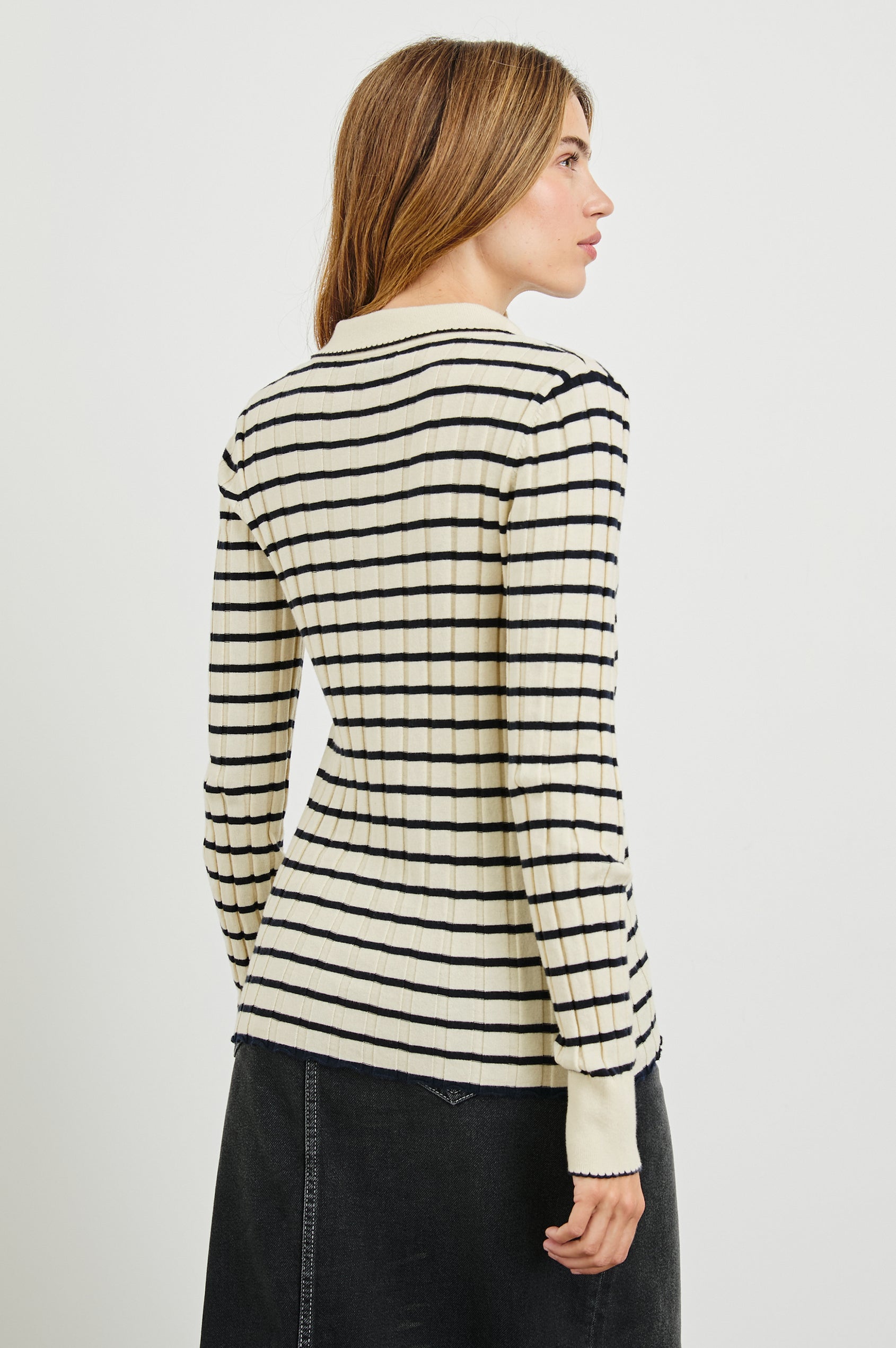Aurelia Long-Sleeve, Wide Ribbed Top with Buttons Down the Front, a Collar and  Scalloped Stitching at the Collar and Cuffs in Ivory Navy Stripe Colorway - Horizontal Stripes - Back View Featured on Model 