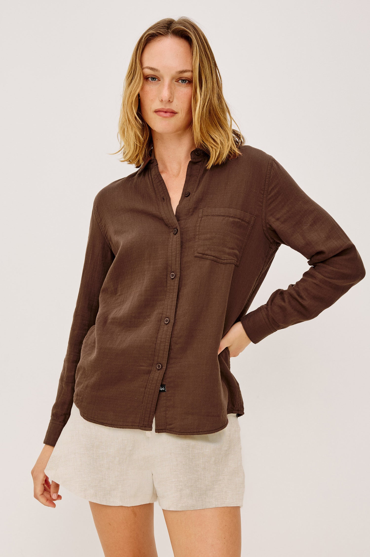 The Austin high-waisted shorts with drawstring waist and side pockets in a relaxed, silky-smooth fabric. Featuring front view on model.