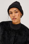 Autumn Cashmere Silk Cuffed Beanie in Black Colorway. Front View Featured on Model.