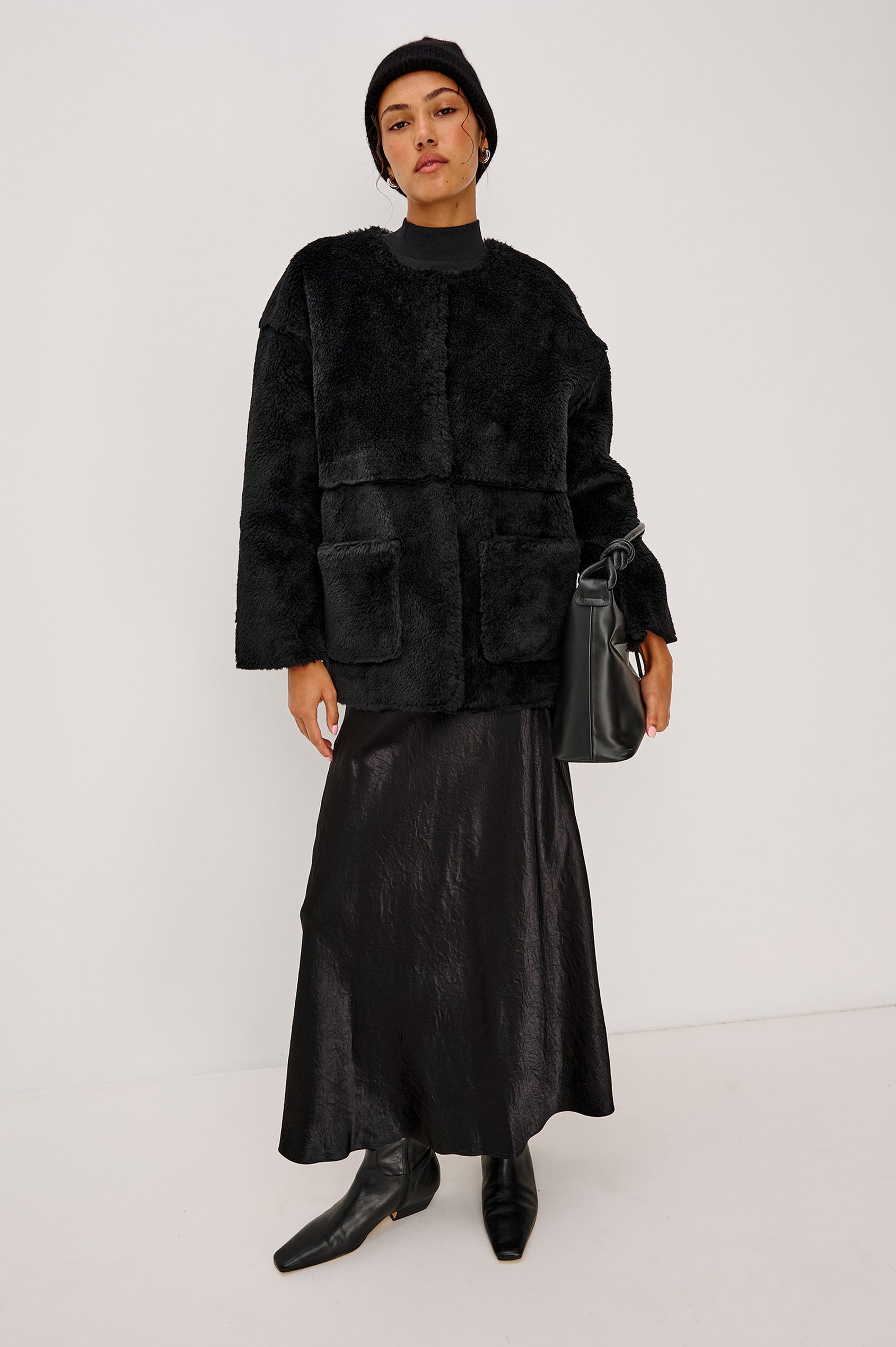 Autumn Cashmere Silk Cuffed Beanie in Black Colorway. Front full body View Featured on Model.