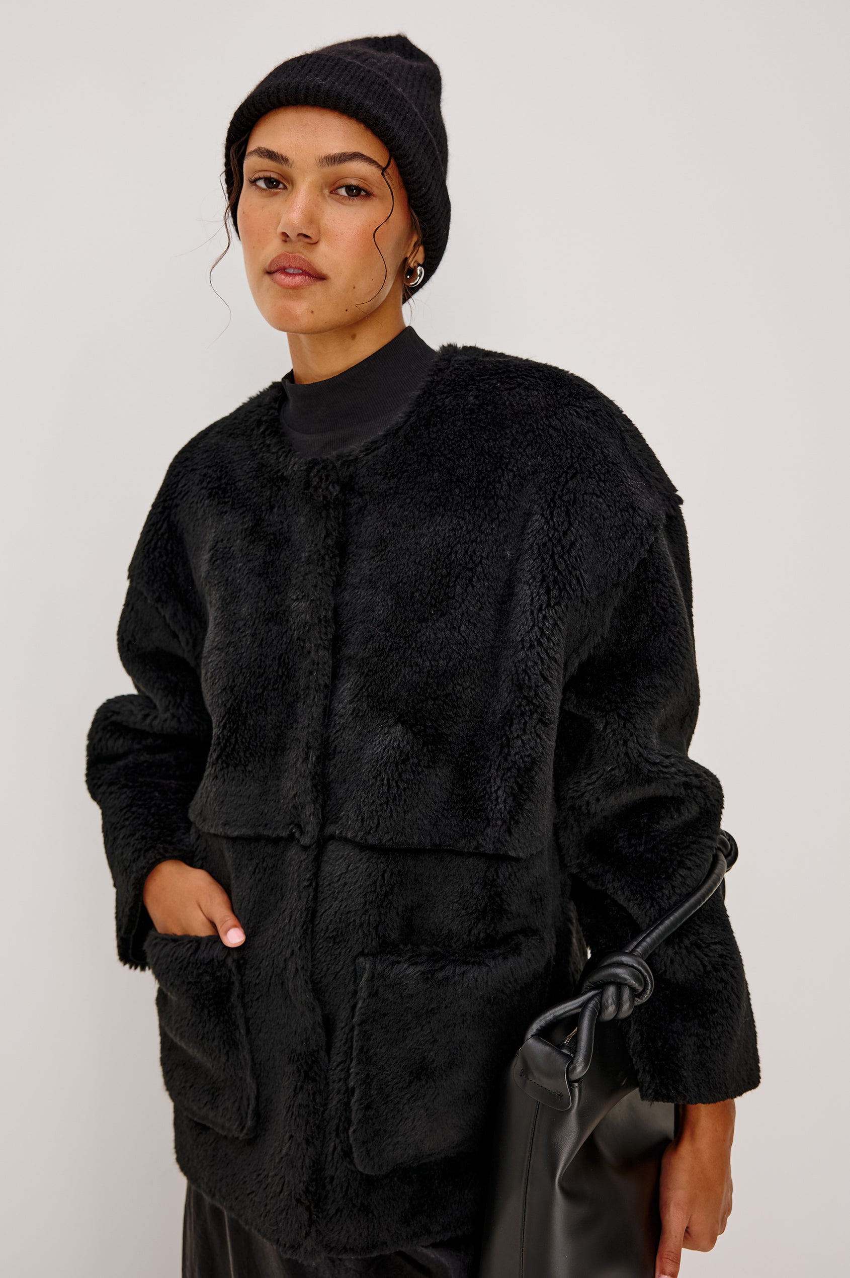 Autumn Cashmere Silk Cuffed Beanie in Black Colorway. Front View Featured on Model.