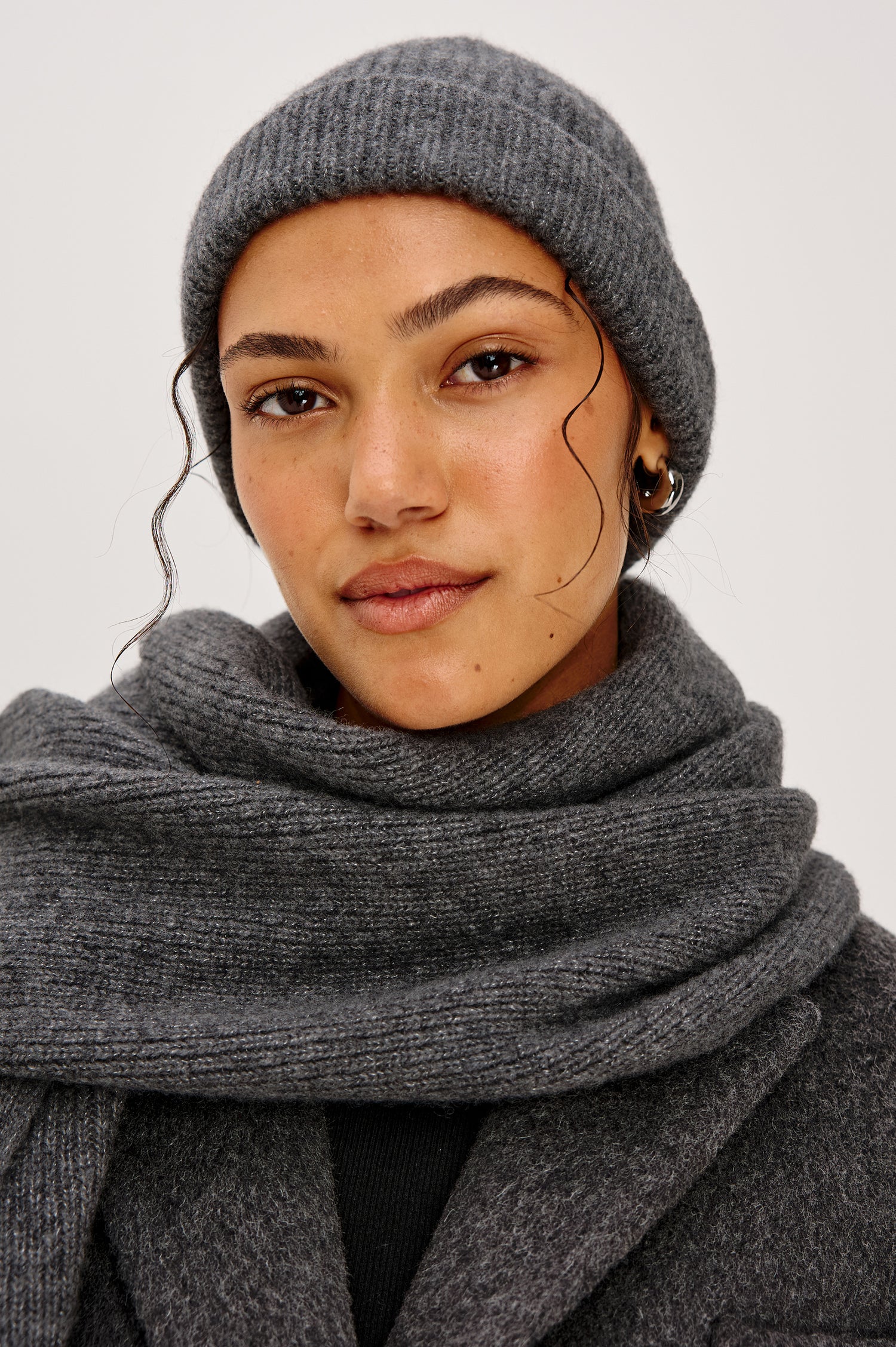 Autumn Cashmere Silk Cuffed Beanie in Thunder Colorway. Front view featured on model.