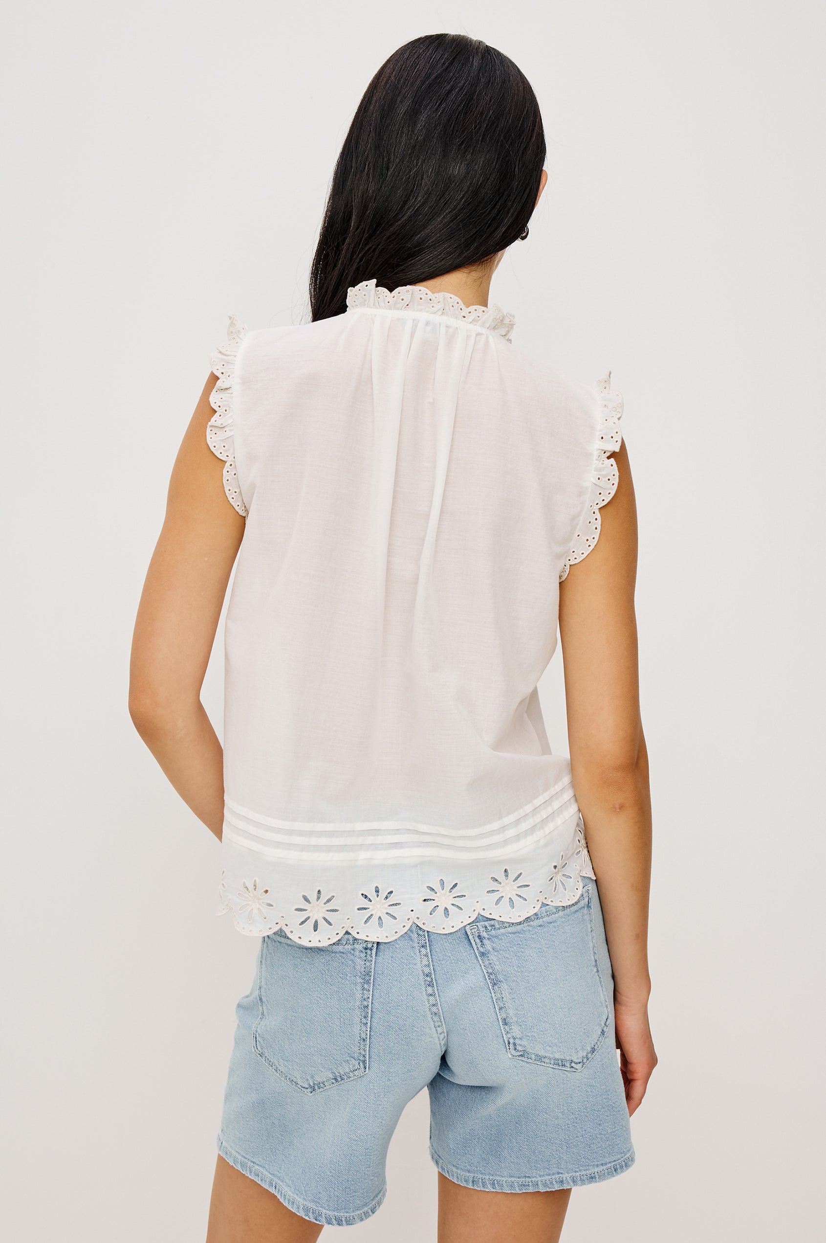 Avery Sleeveless Top in Cotton Voile With Scalloped Embroidered Trim, Front Buttons, and Relaxed Fit in White Colorway - Upper Body Back View Featured on Model
