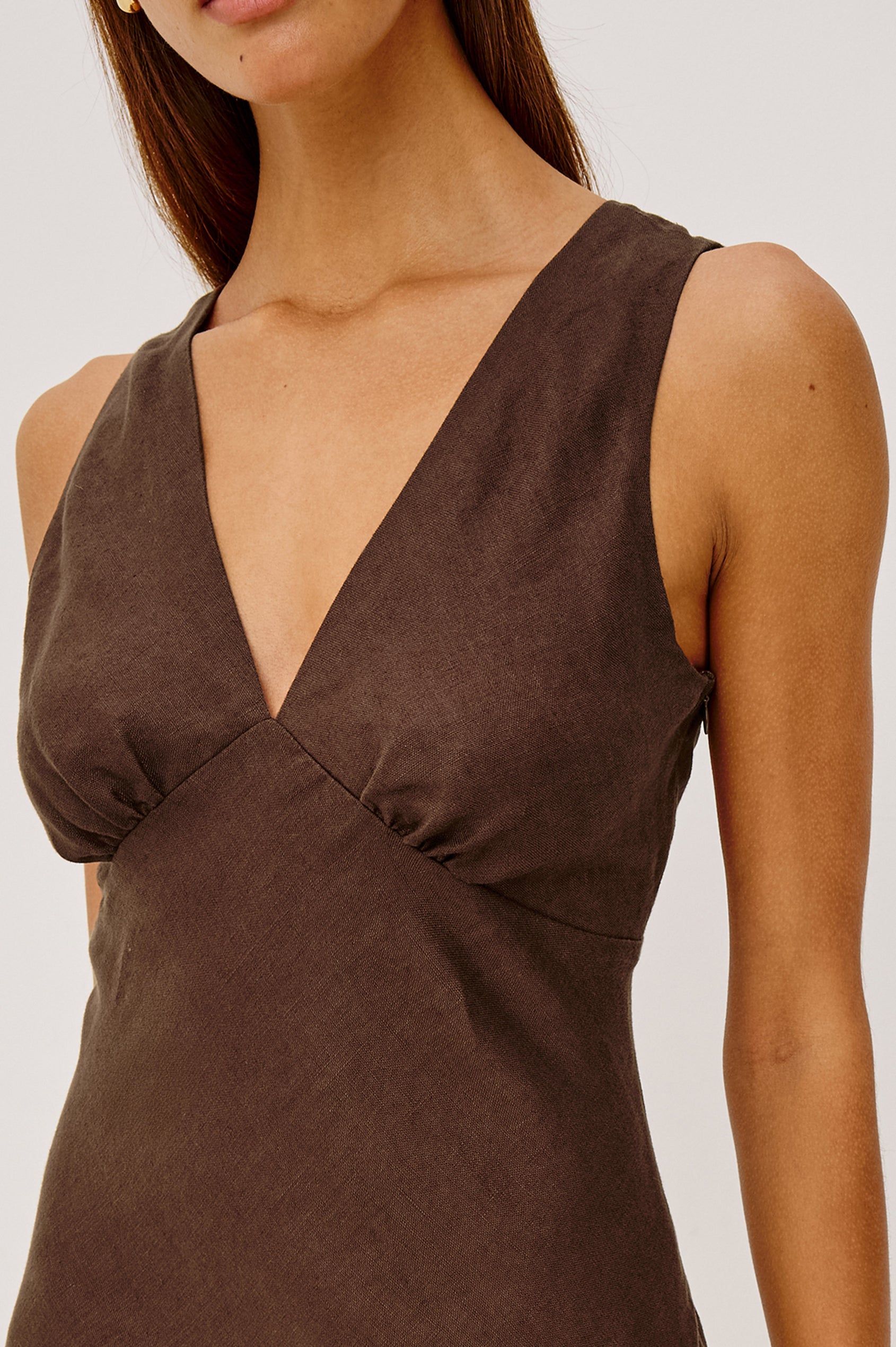 Avianna Midi Dress in Linen With Sleeveless Bias Cut, Plunging V-Neckline, Empire Waist, and Hidden Side Zip in Espresso Colorway - Upper Body Front View Featured on Model