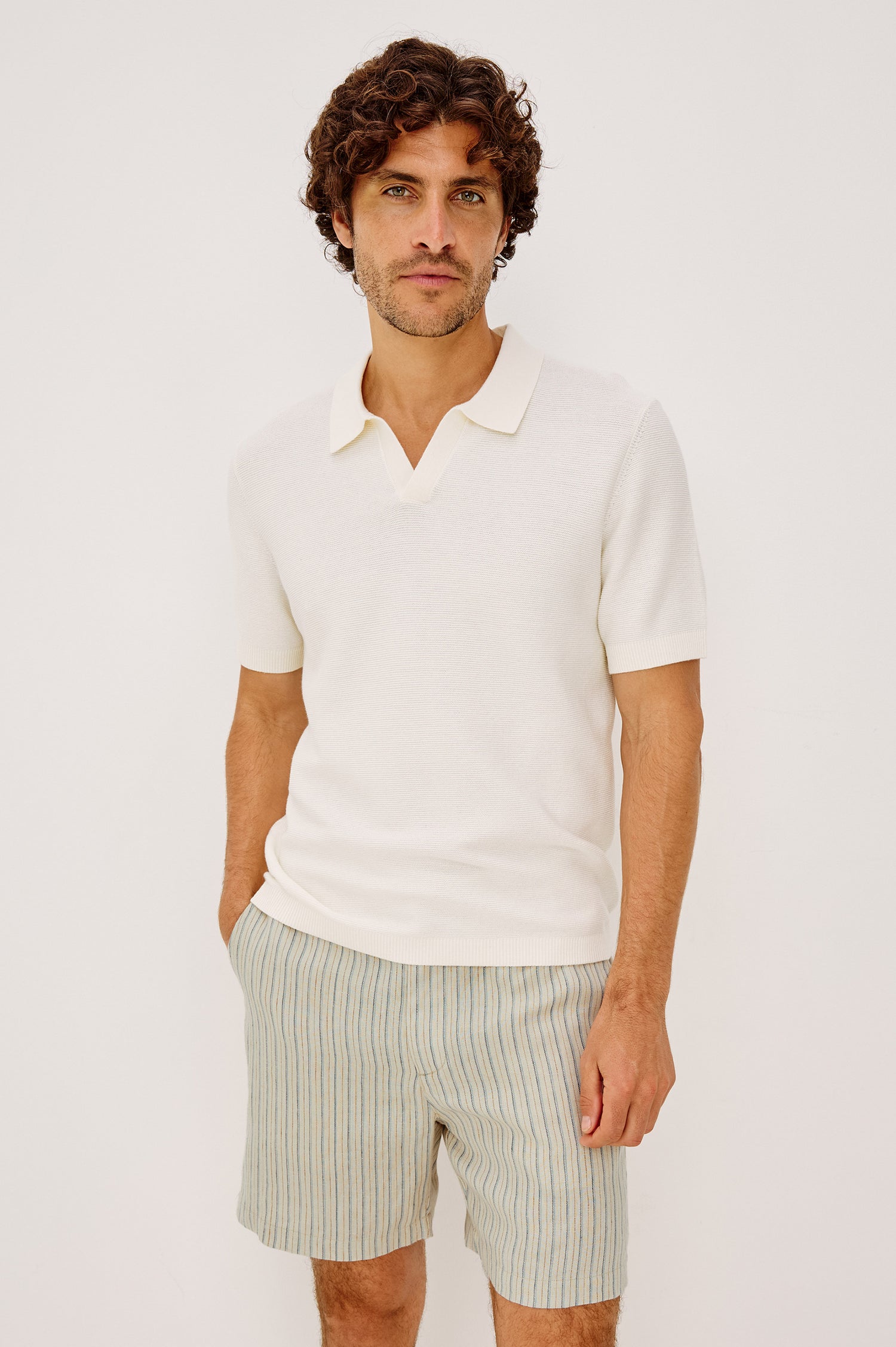Baker Polo Shirt in Rib Cotton Knit With Colar, Short Sleeves, and Relaxed Fit in Ivory Colorway - Upper Body Front View Featured on Model