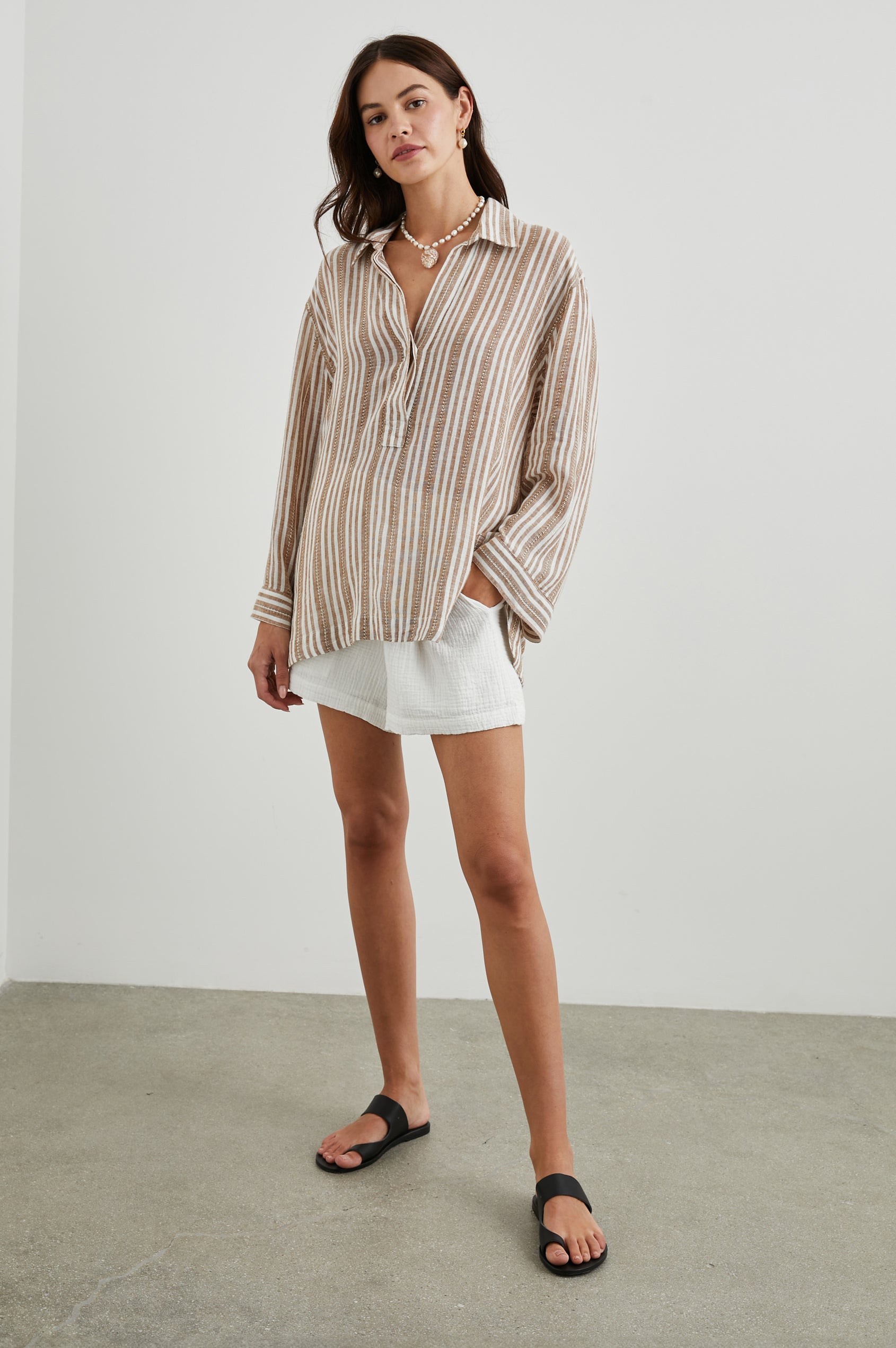 Banks Long-Sleeve Top with Wide Sleeves, a Collar, and a V neck with a Half-Sealed Placket in Palo Santo Stripe Colorway, with Textured Brown and White Vertical Stripes - Front Full Body View Featured on Model
