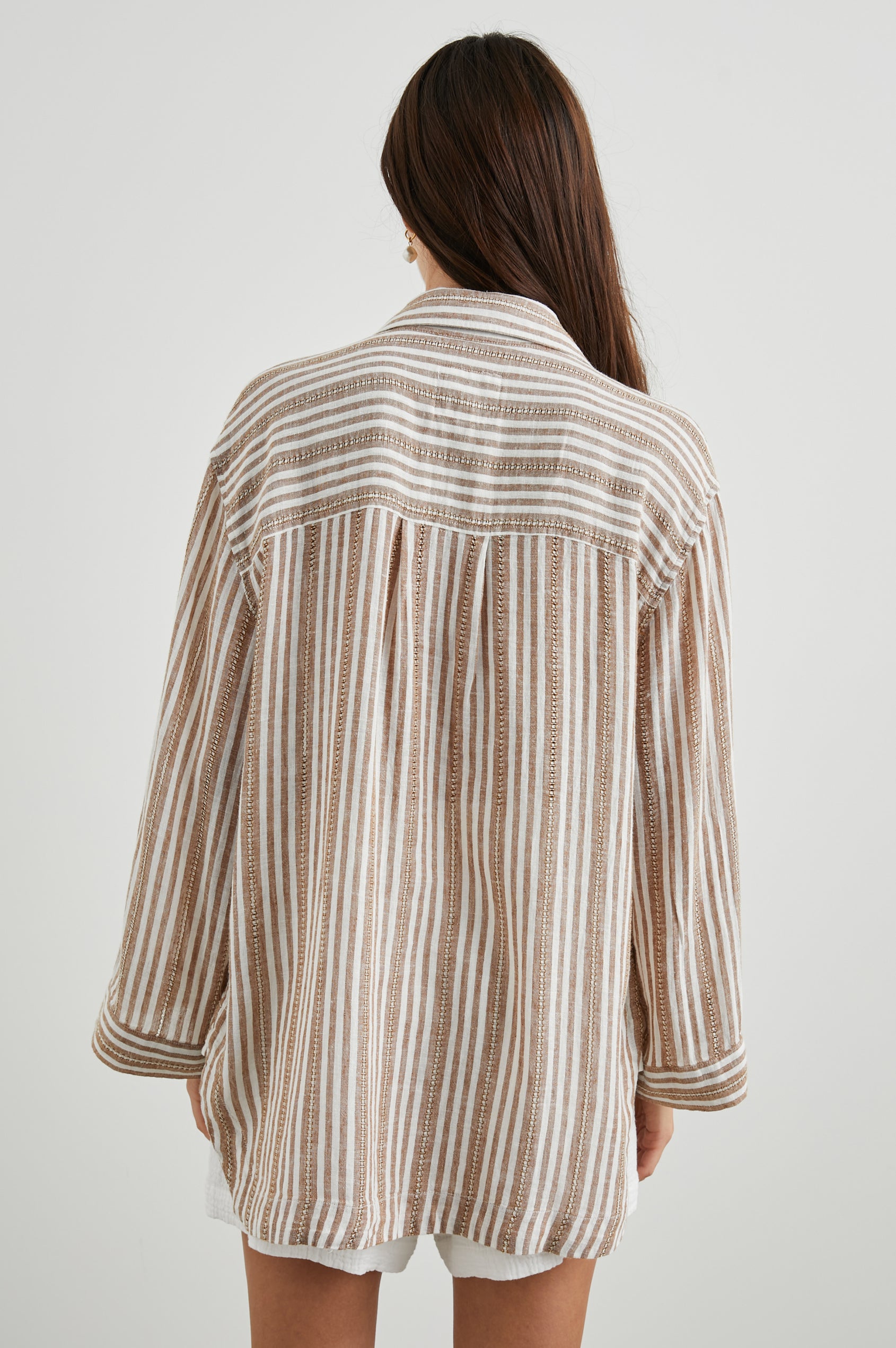 Banks Long-Sleeve Top with Wide Sleeves, a Collar, and a V neck with a Half-Sealed Placket in Palo Santo Stripe Colorway, with Textured Brown and White Vertical Stripes - Back View Featured on Model