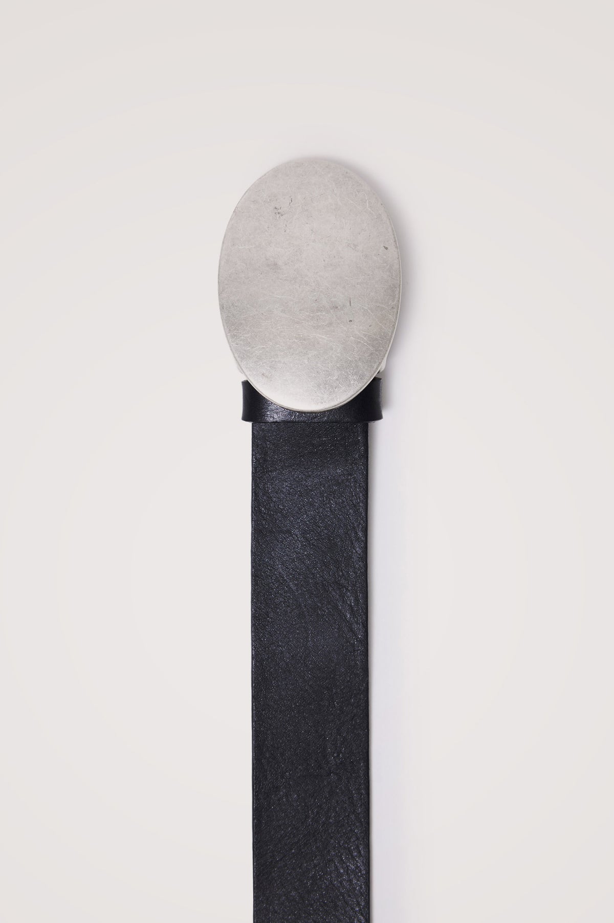 Barcelona Belt in Top Grain Italian Leather With Oversized Oval Plaque Buckle and 5-Hole Adjustability in Black Silver Colorway - Flat Lay Product View Featured