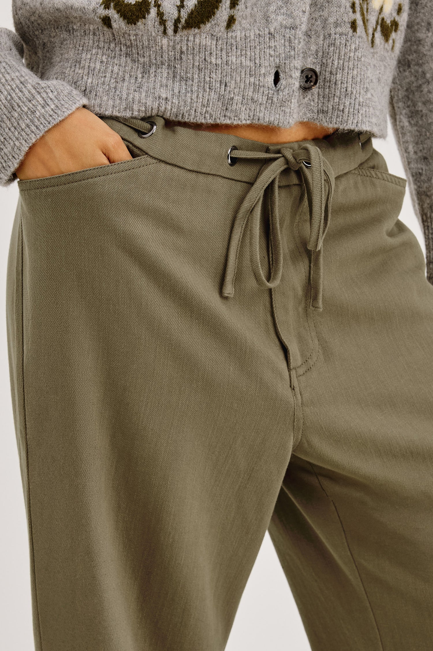 Barry Pant in Cotton Lyocell Denim With Wide Legs That Taper at Hem, Front Zip, Grommet Drawstring Waistband, and Side Slant Pockets in Olive Colorway - Lower Body Close Up View Featured on Model