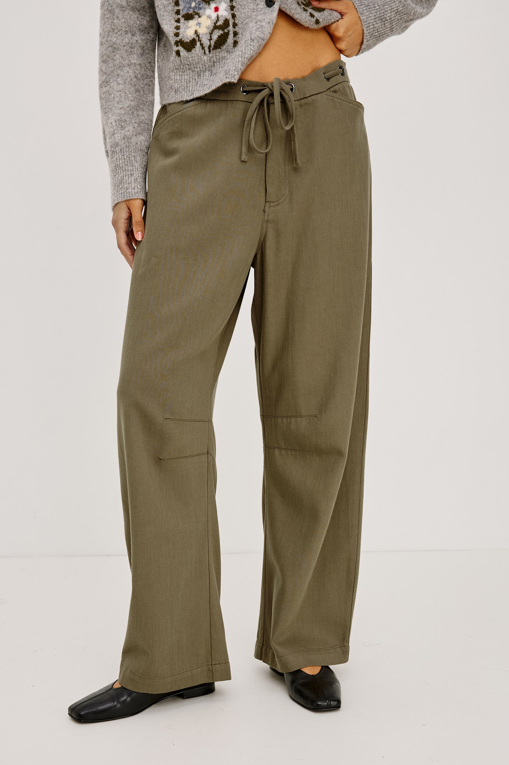 Barry Pant in Cotton Lyocell Denim With Wide Legs That Taper at Hem, Front Zip, Grommet Drawstring Waistband, and Side Slant Pockets in Olive Colorway - Lower Body Front View Featured on Model