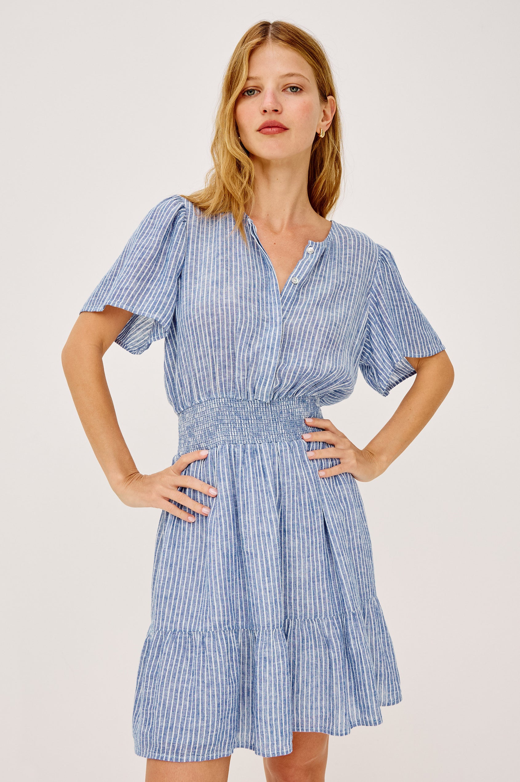 Bea Mini Dress in Lightweight Linen With Half-Placket Neckline, Short Flared Sleeves, Fully Lined Tiered Skirt, and Shirred Waist in Barletta Stripe Colorway - Upper Body Front View Featured on Model