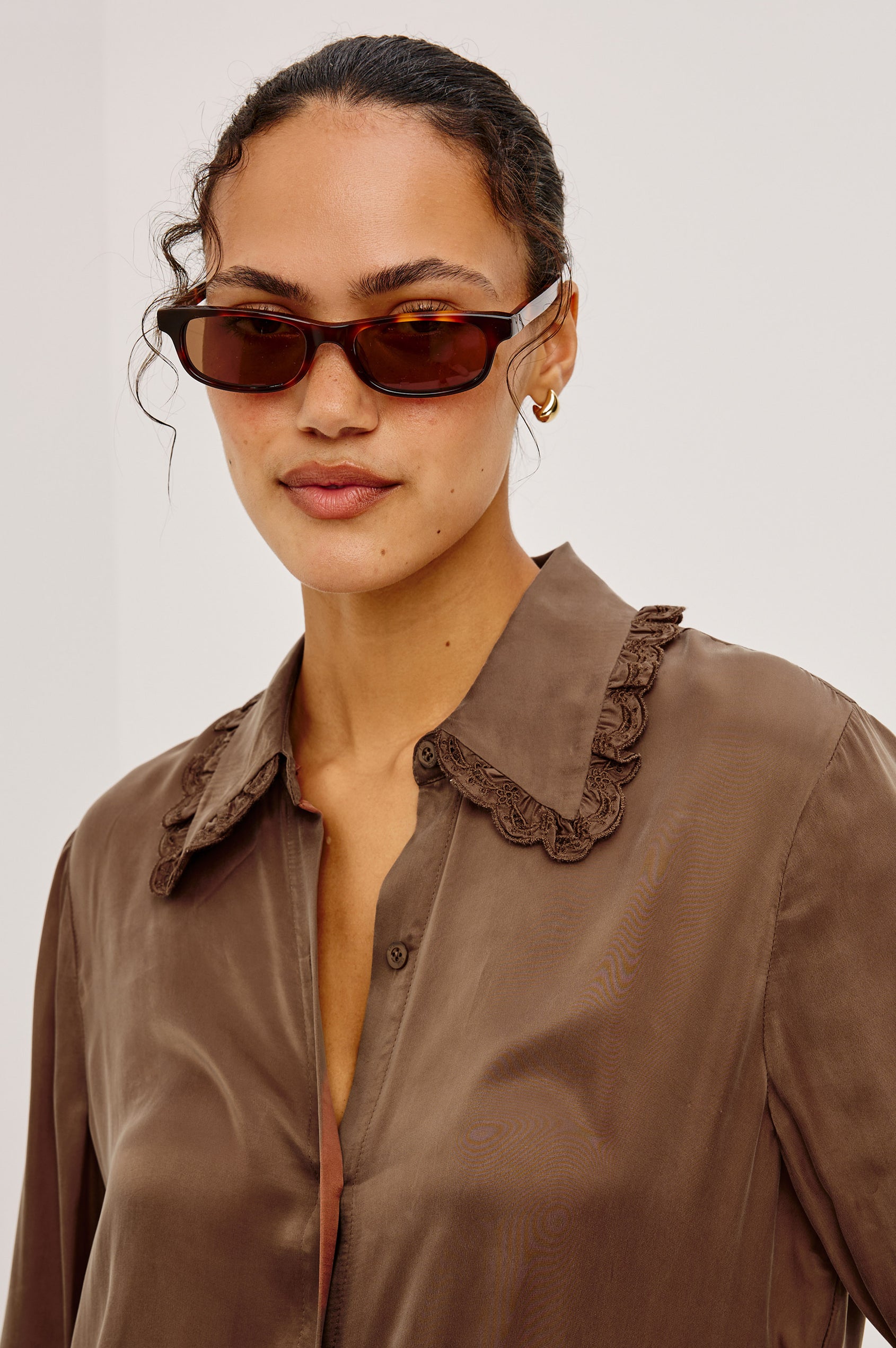 Beatrix Shirt in Smooth Cupro With Point Collar, Eyelet Ruffle Trim, Relaxed Fit, and Long Sleeves in Ivory Colorway - Upper Body Front View Featured on Model