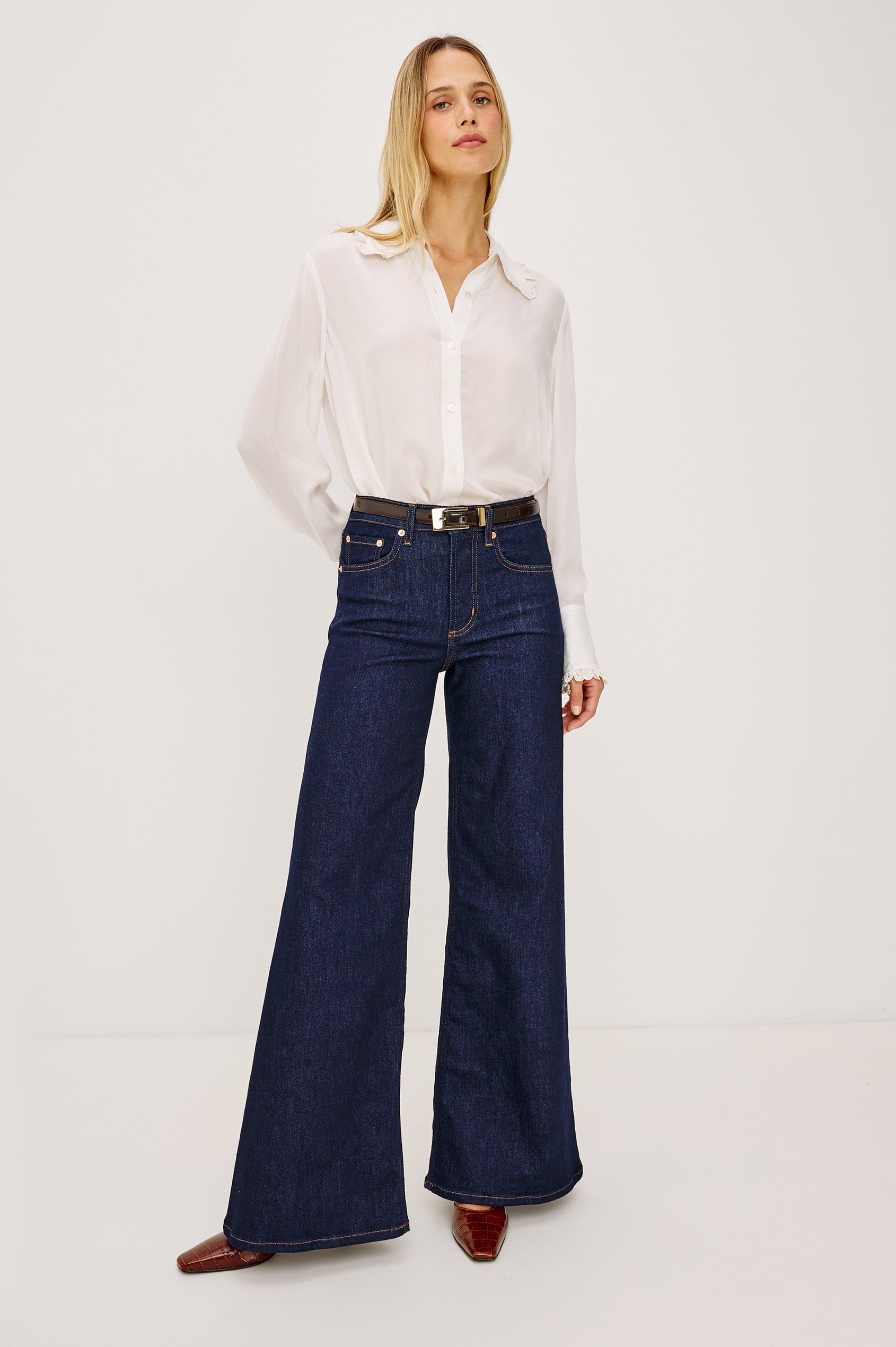 Beatrix Shirt in Smooth Cupro With Point Collar, Eyelet Ruffle Trim, Relaxed Fit, and Long Sleeves in Ivory Colorway - Full Body Front View Featured on Model
