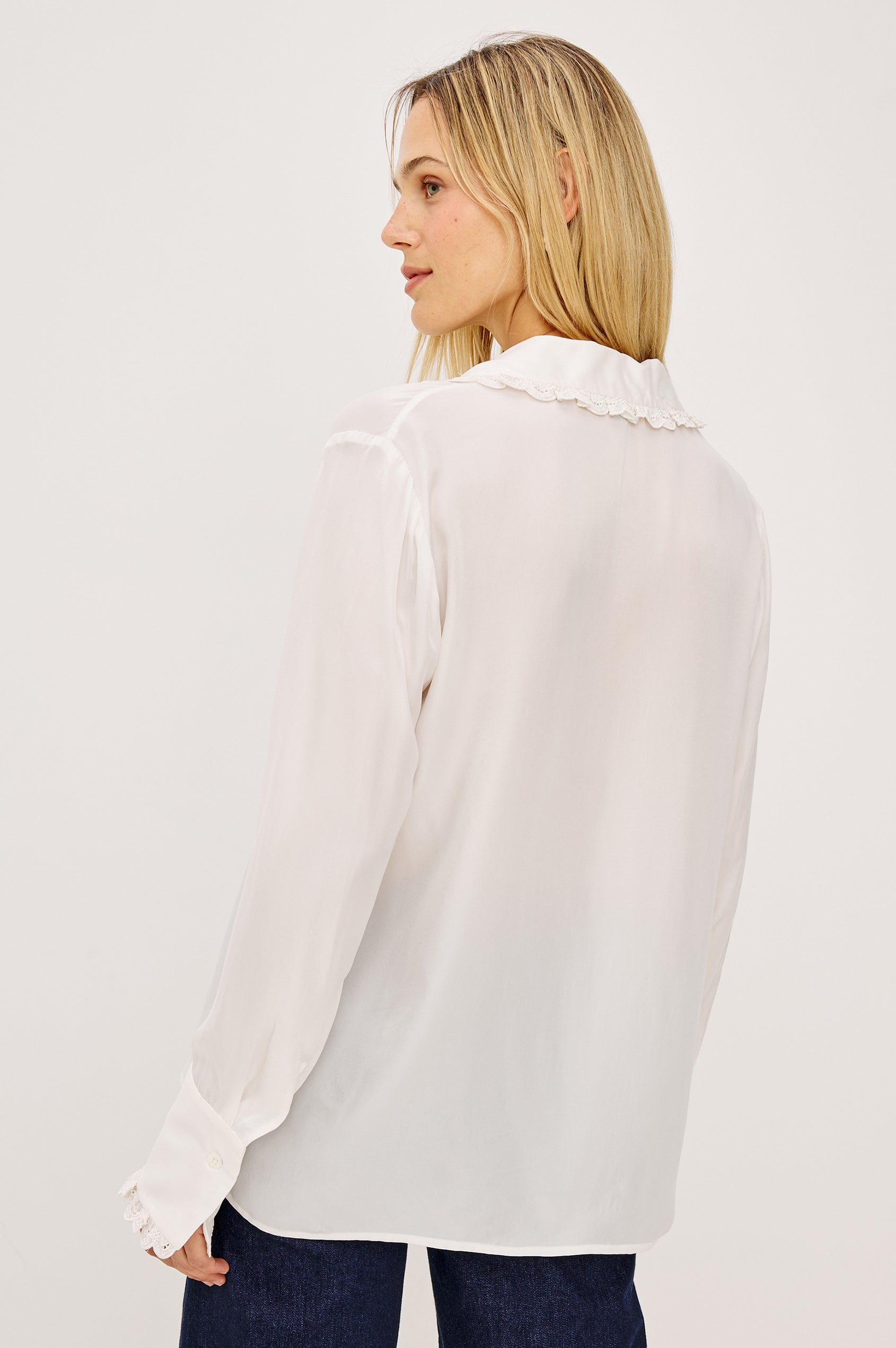 Beatrix Shirt in Smooth Cupro With Point Collar, Eyelet Ruffle Trim, Relaxed Fit, and Long Sleeves in Ivory Colorway - Upper Body Back View Featured on Model