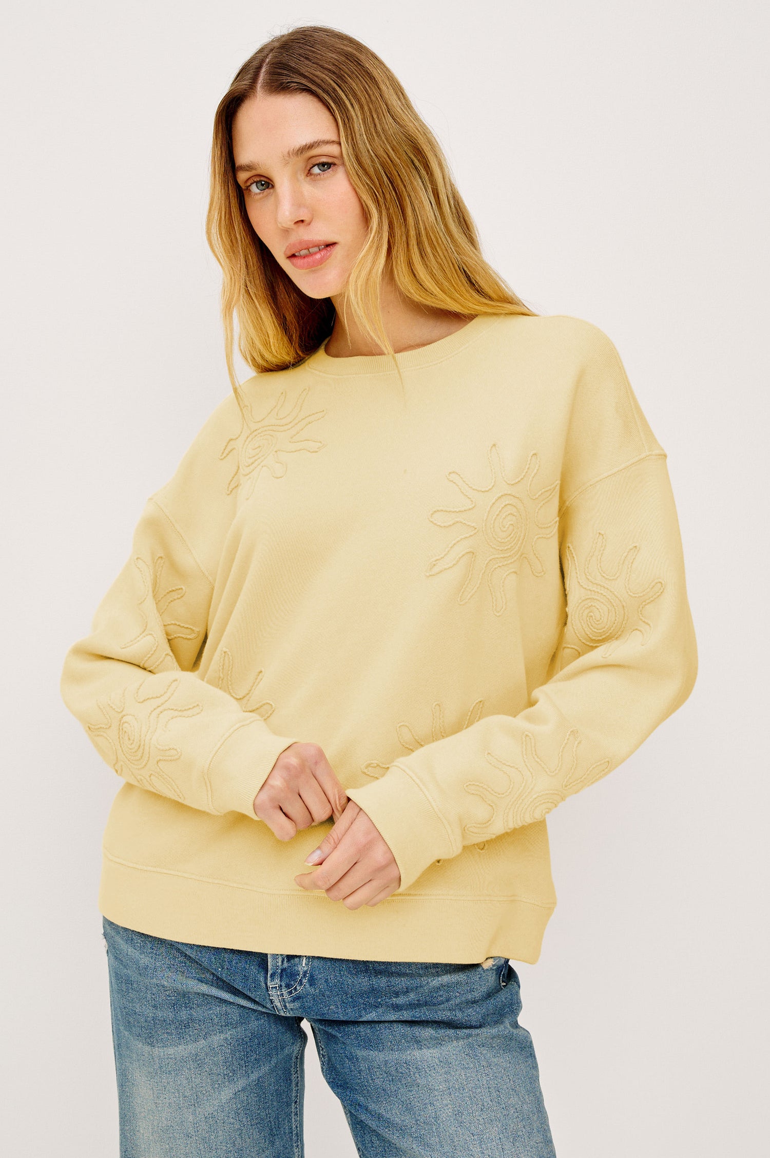 Beckley Sweatshirt in French Terry With Soutached Suns, Relaxed Fit, and Long Sleeves in Sunshine Colorway - Upper Body Front View Featured on Model