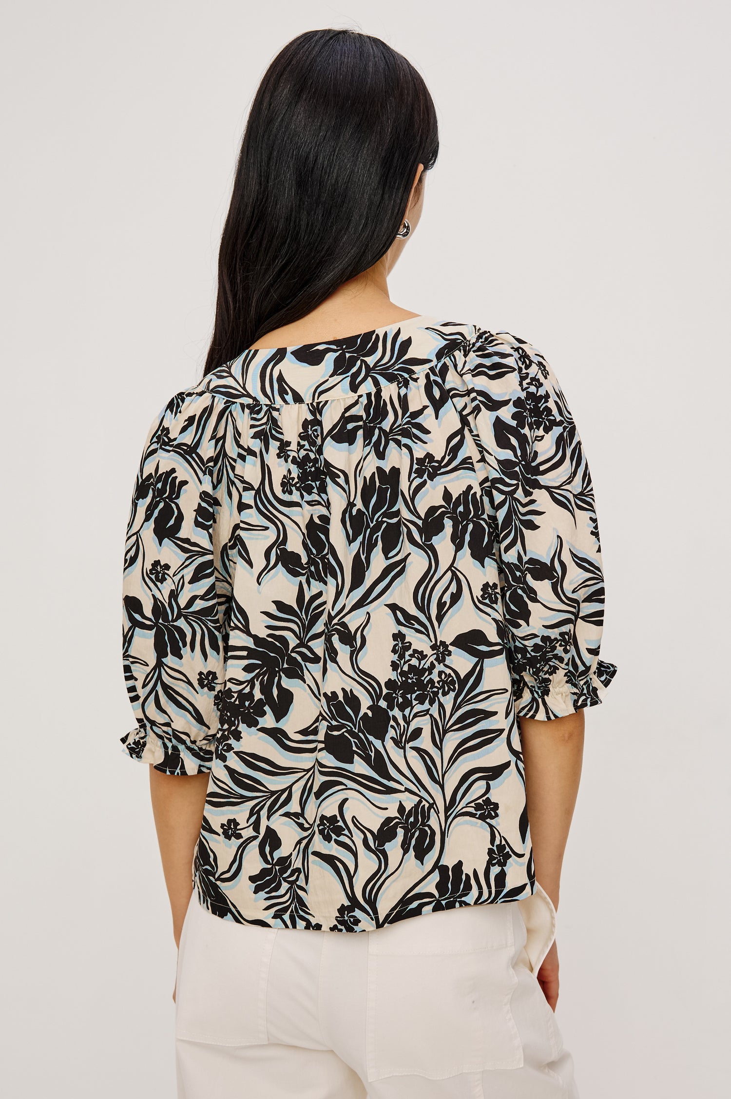 Belina Peasant Top in Crinkle Poplin With Gathered V-Neckline With Self Ties, Blanket Stitch Embroidered Trim, Loose Fit, and Elbow-Length Puff Sleeves With Elastic Cuffs in Zinya Colorway - Upper Body Back View Featured on Model
