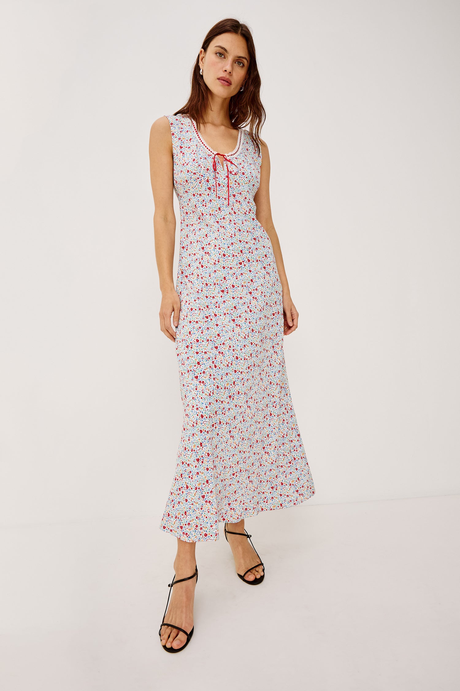 Bella sleeveless midi dress, with a scoop neck, and a front tie detail in meadow colorway, blue, pink and white - full body front view show on model.