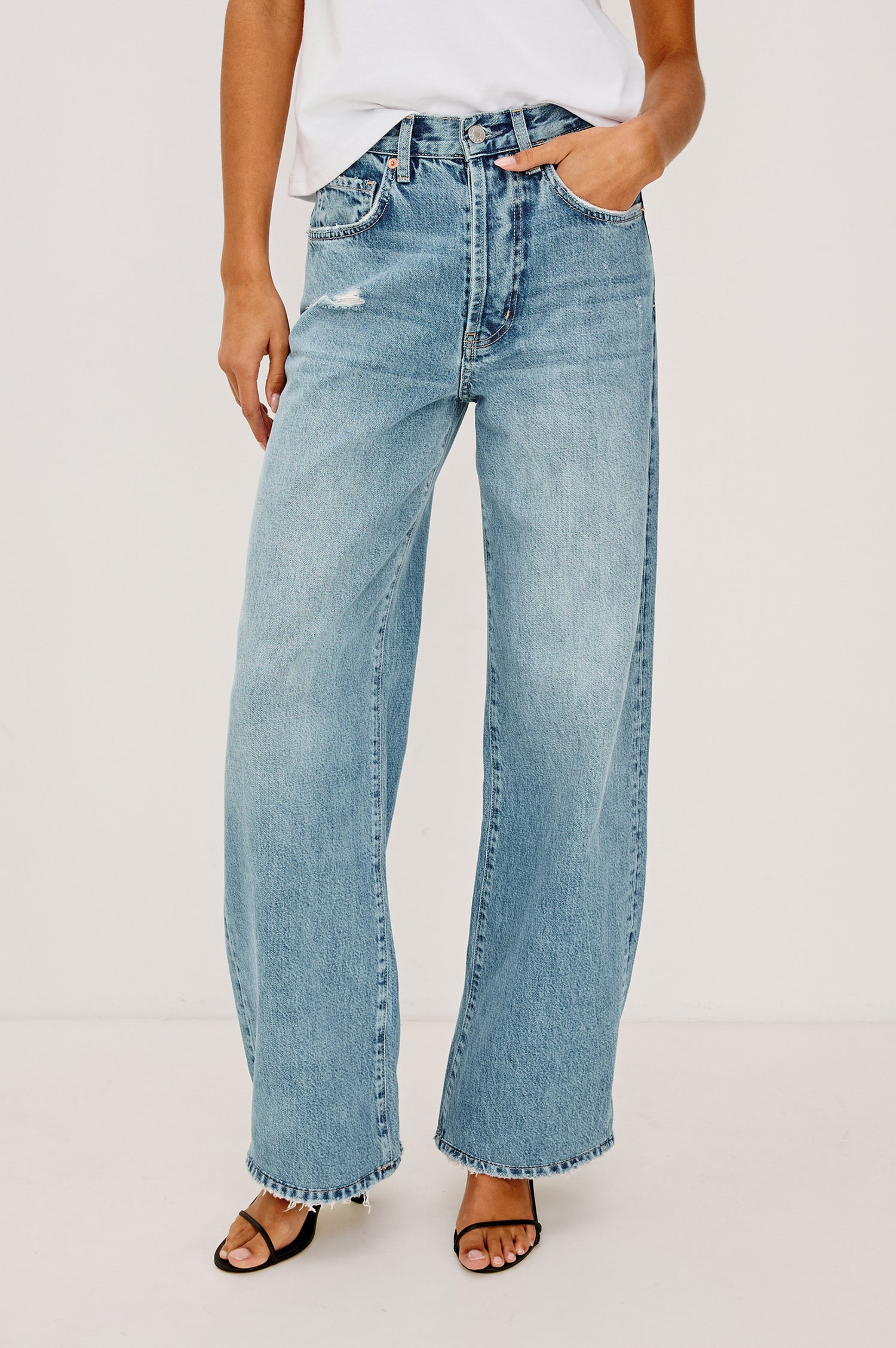 Belmont Arc Leg Jean in Rigid Denim With High-Waisted Fit, Button Fly, and 32″ Inseam in Authentic Stone Colorway - Lower Body Front View Featured on Model